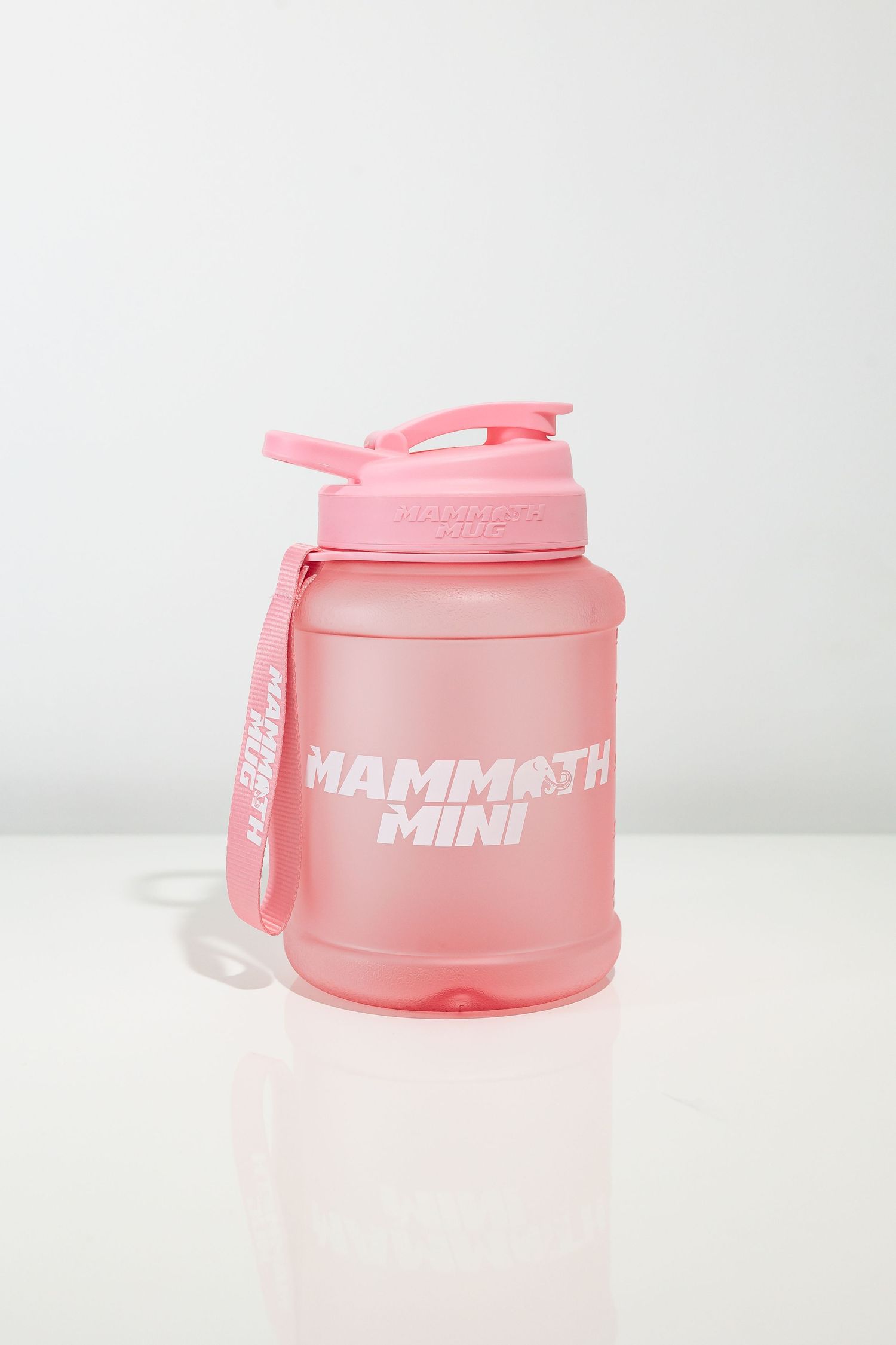 Pink Mammoth Mini protein shaker bottle photographed against white background.