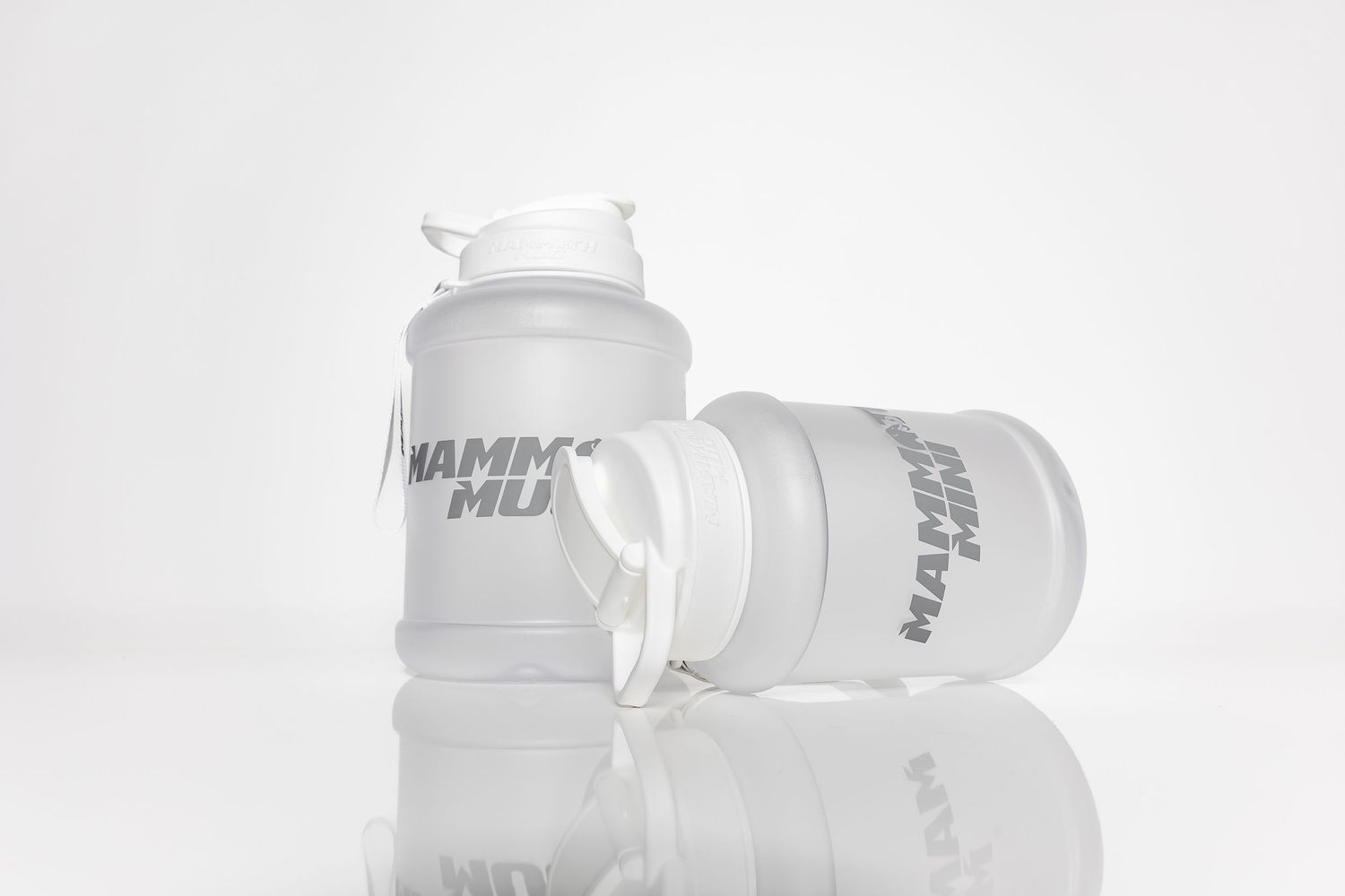 Clear plastic water bottles arranged in a minimalist white background setting.