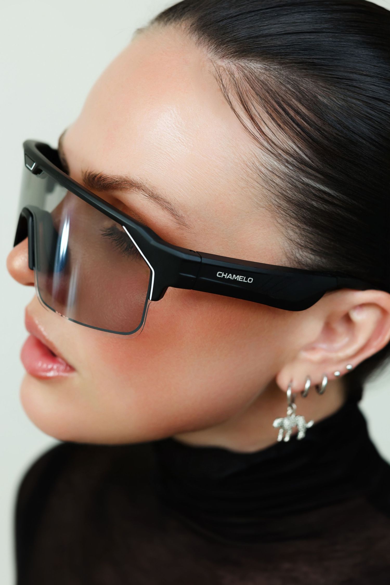 Elegant eyewear campaign featuring minimalist styling and dramatic side profiles.