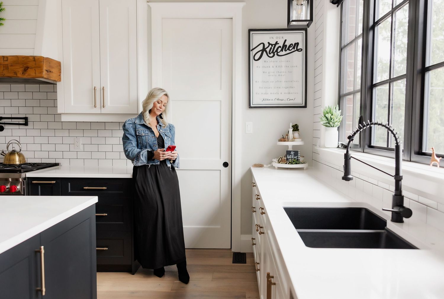 Contemporary kitchen design with white cabinetry and stainless steel appliances.