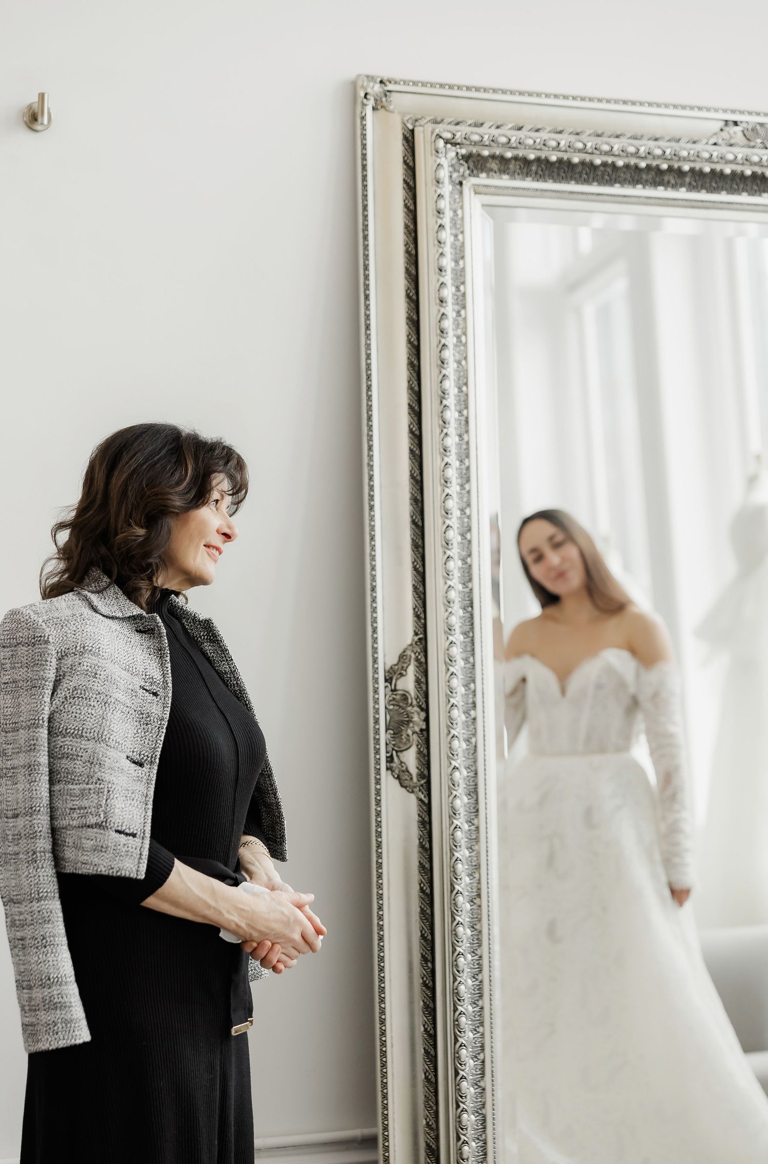 Wedding dress consultation with stylists in a bright modern boutique setting.