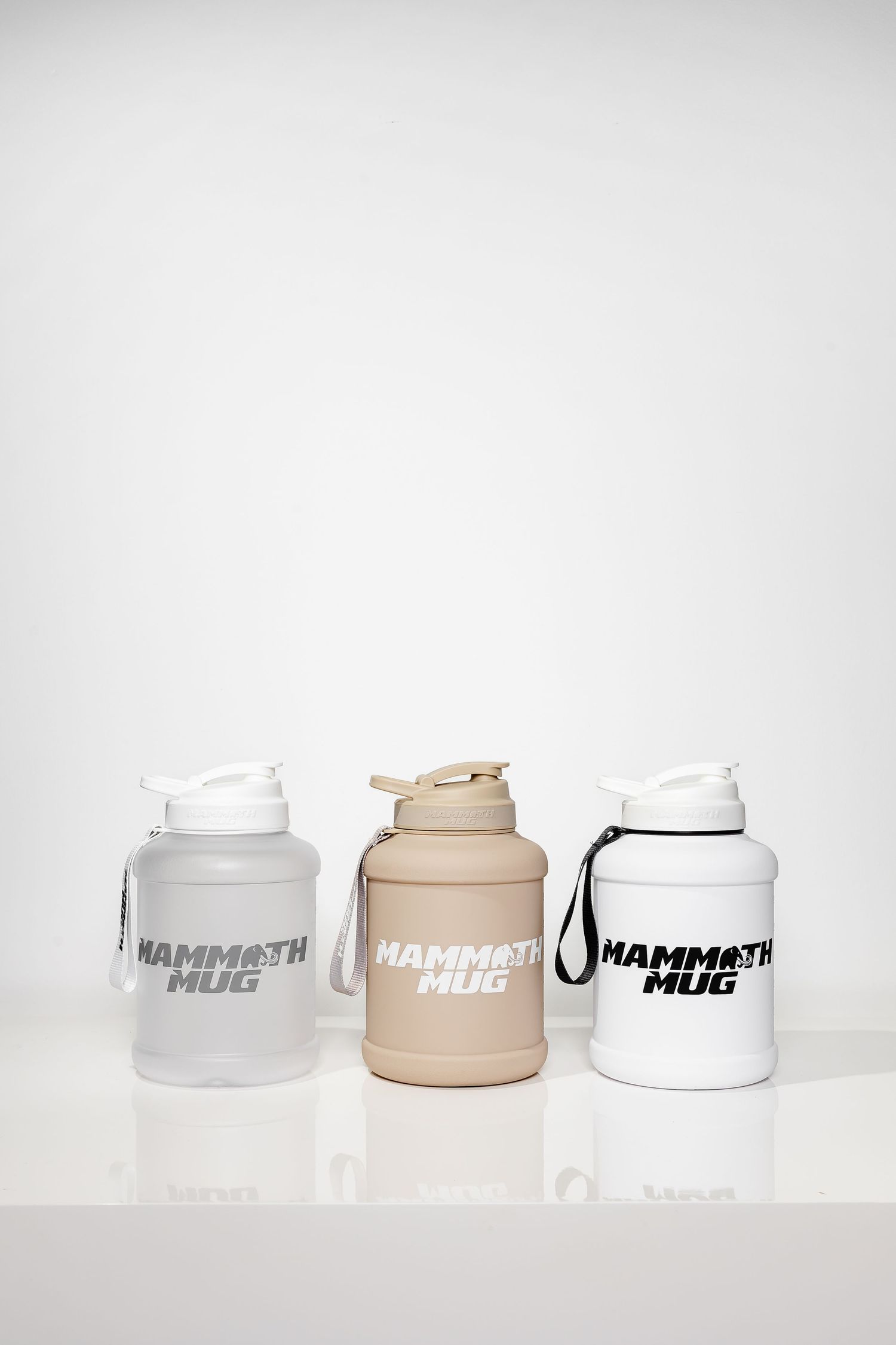 Mammoth Mini branded drink containers in white, beige and clear colors displayed in a row.