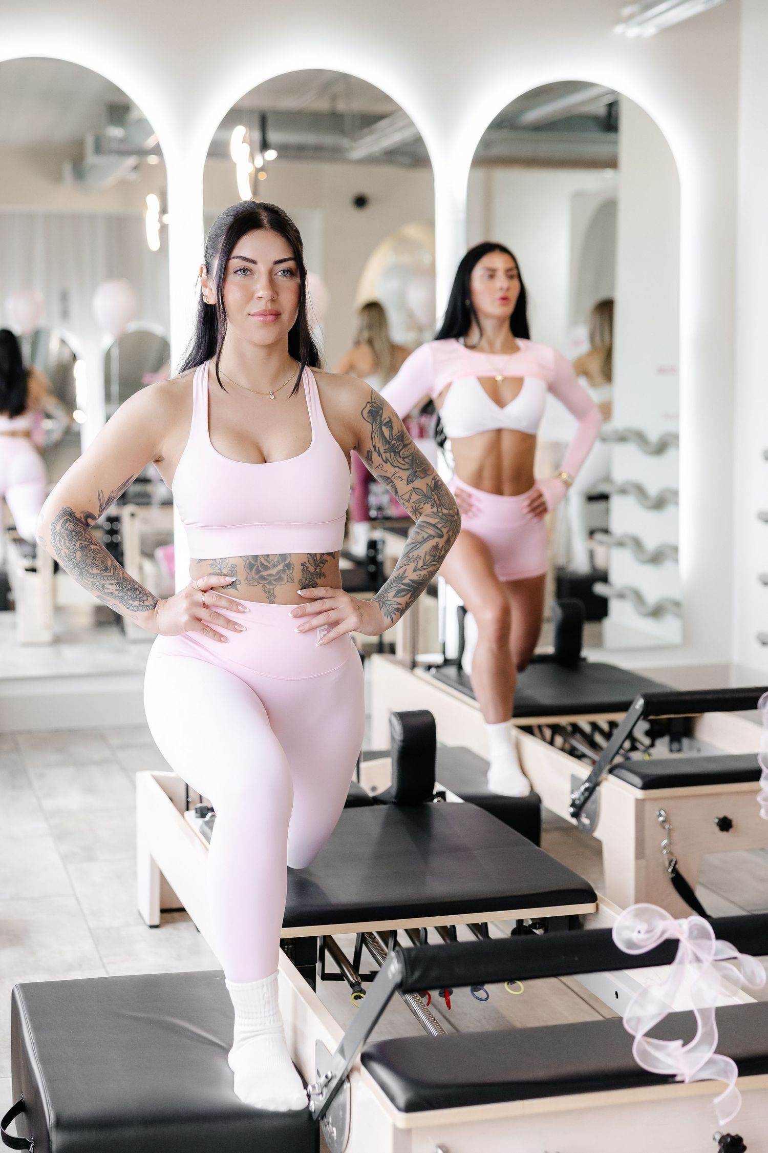 Person demonstrating various Pilates positions on reformer equipment in a white studio space.