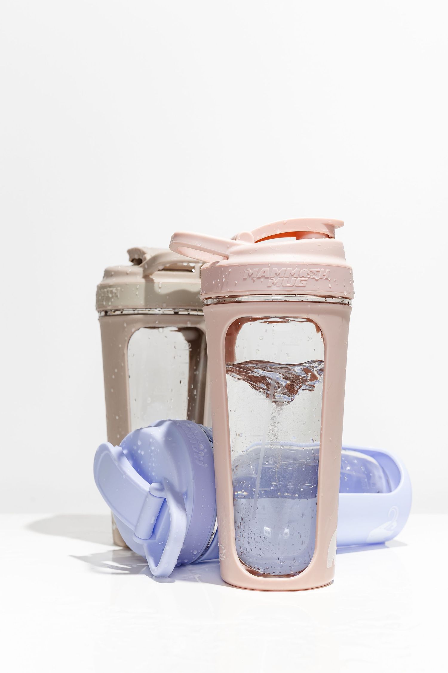 Pink drink container with transparent window showing water movement.