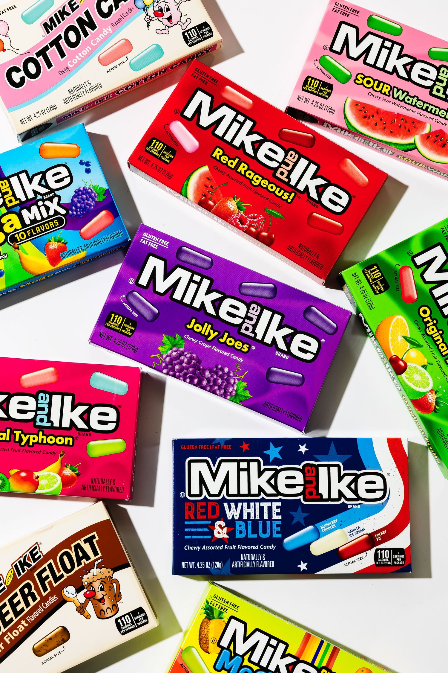 Collection of colorful Mike and Ike candy boxes in various flavors.