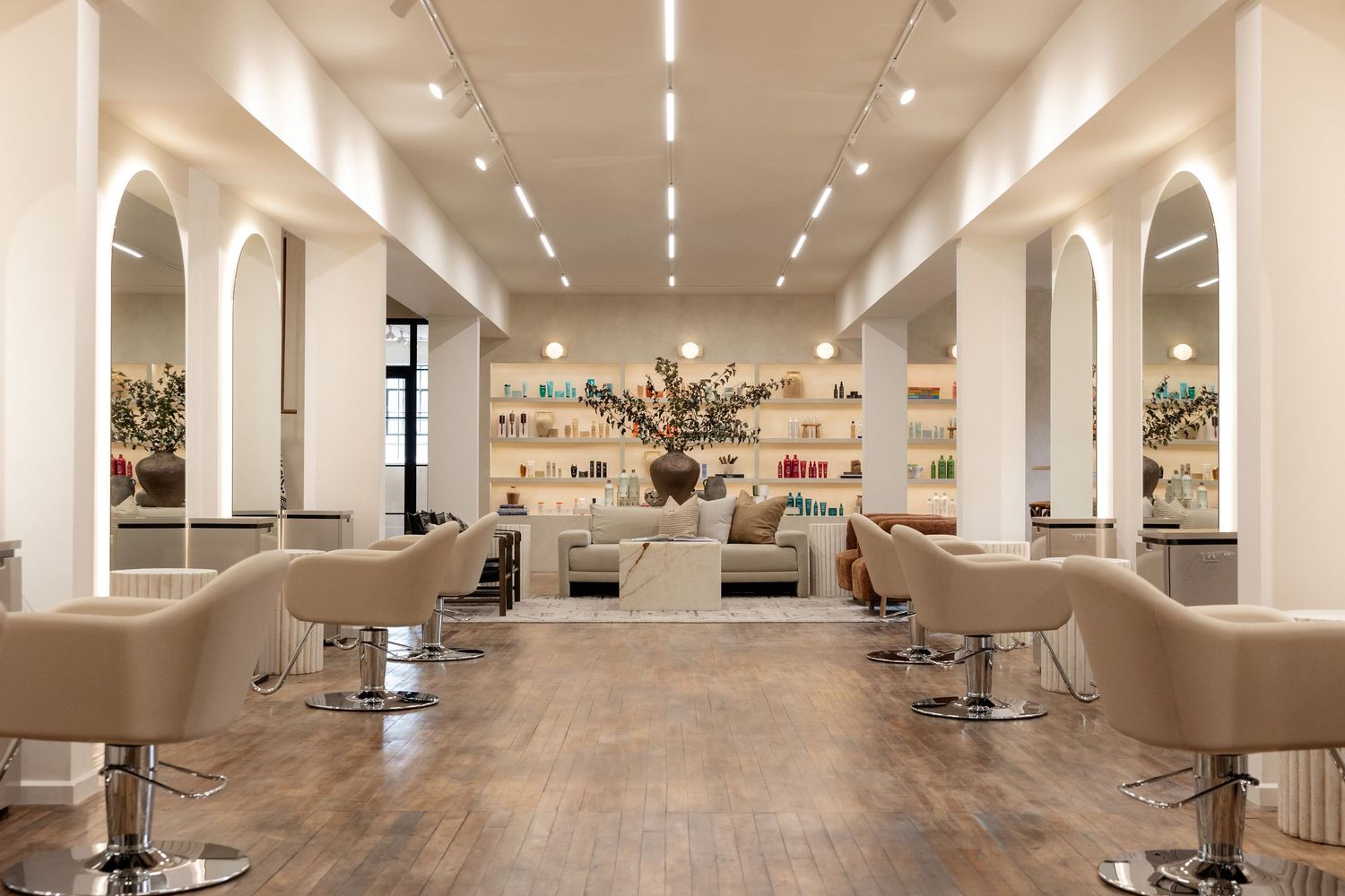 Panoramic view of contemporary salon space with clean lines and professional styling areas.