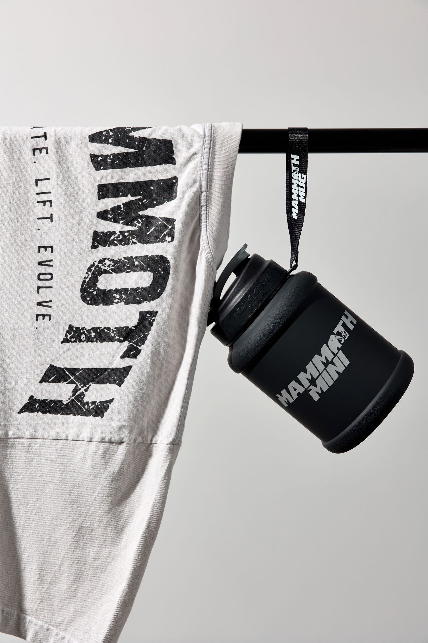 White t-shirts with black text prints displayed with matching water bottles.