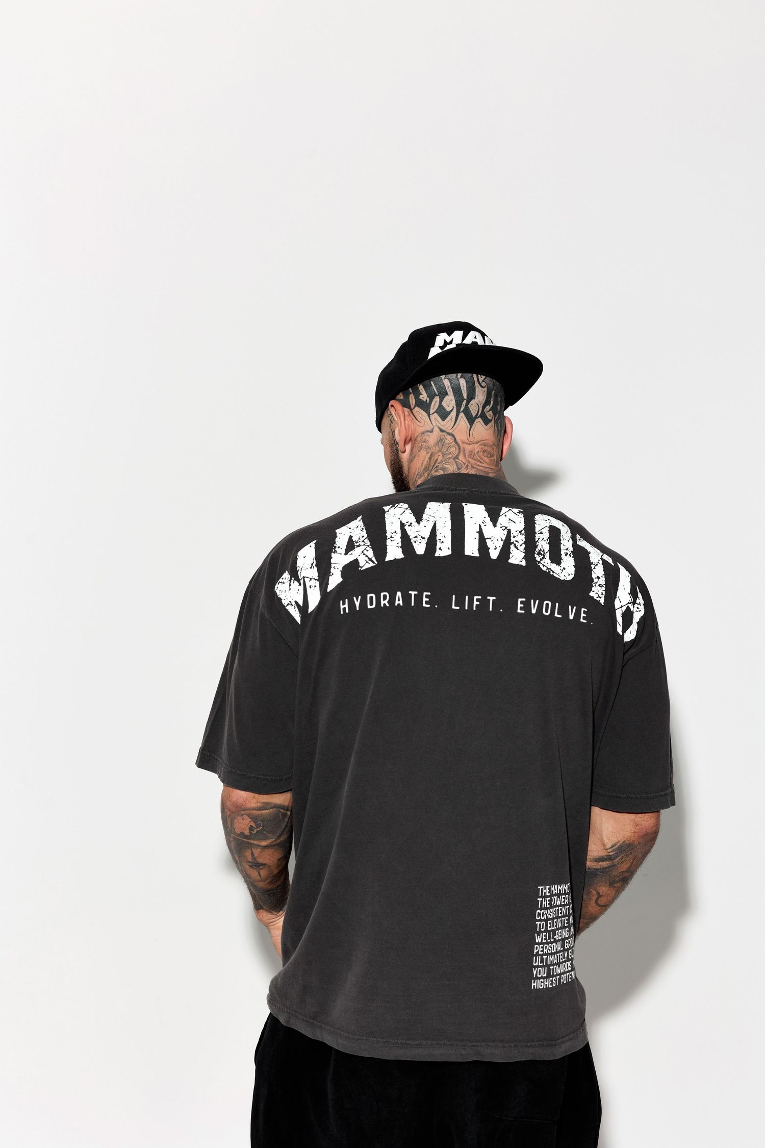 Back view of black t-shirt with MAMMOTH text and motivational messaging.