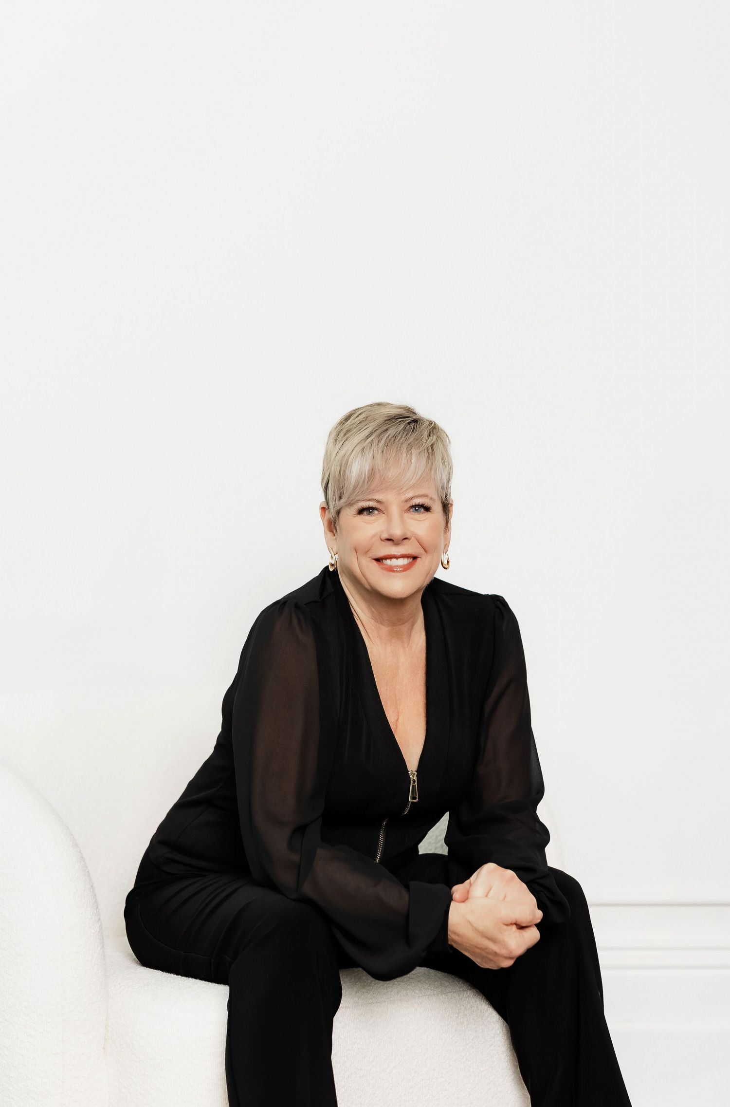 Candid portraits showing joyful expressions against white studio background.