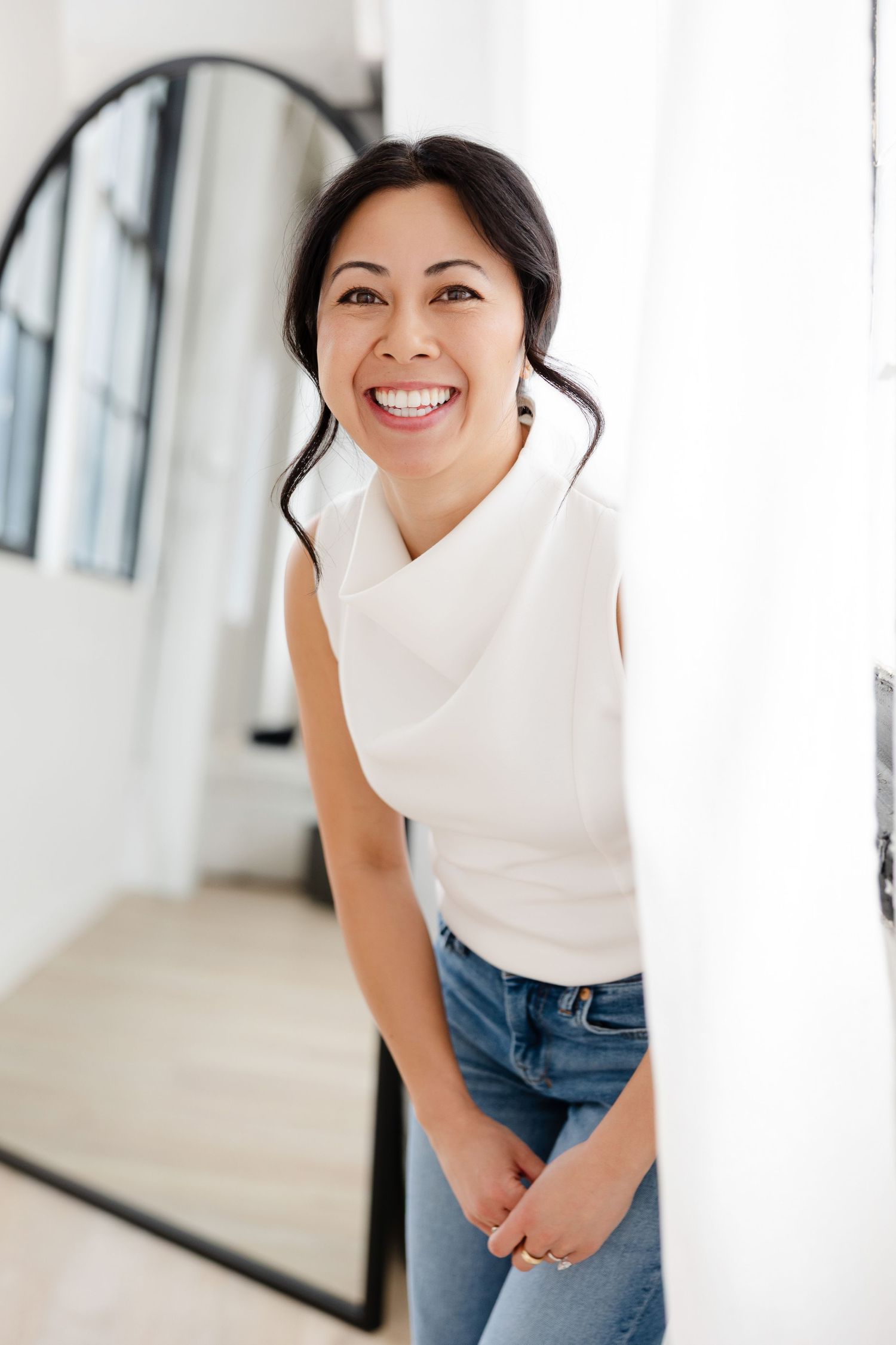 Bright and airy studio portrait with casual styling and natural expressions.