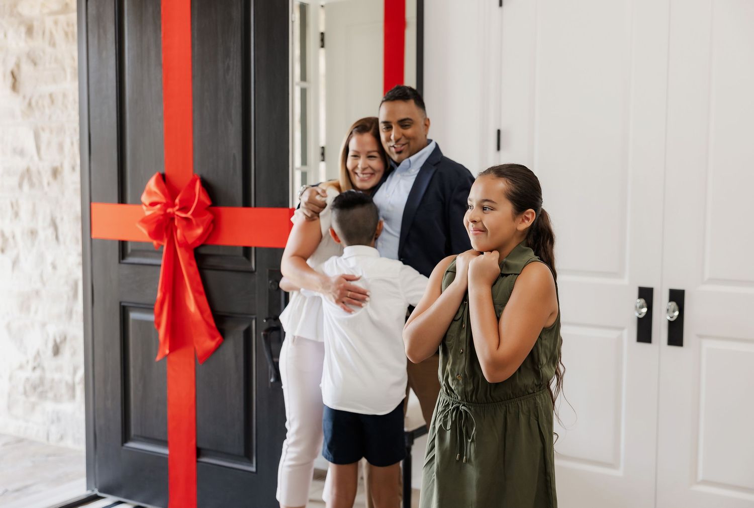 Business meeting in office hallway with red decorative accents.