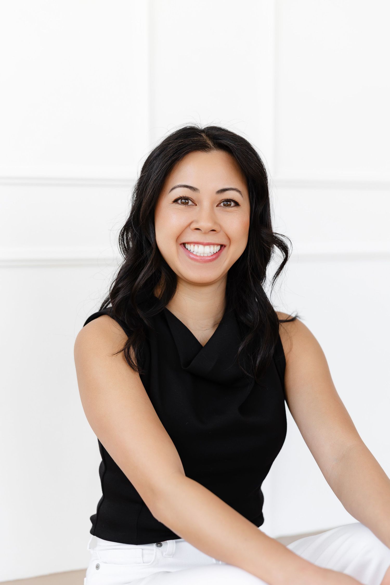 Bright professional photography setup with clean white backdrop and natural lighting.