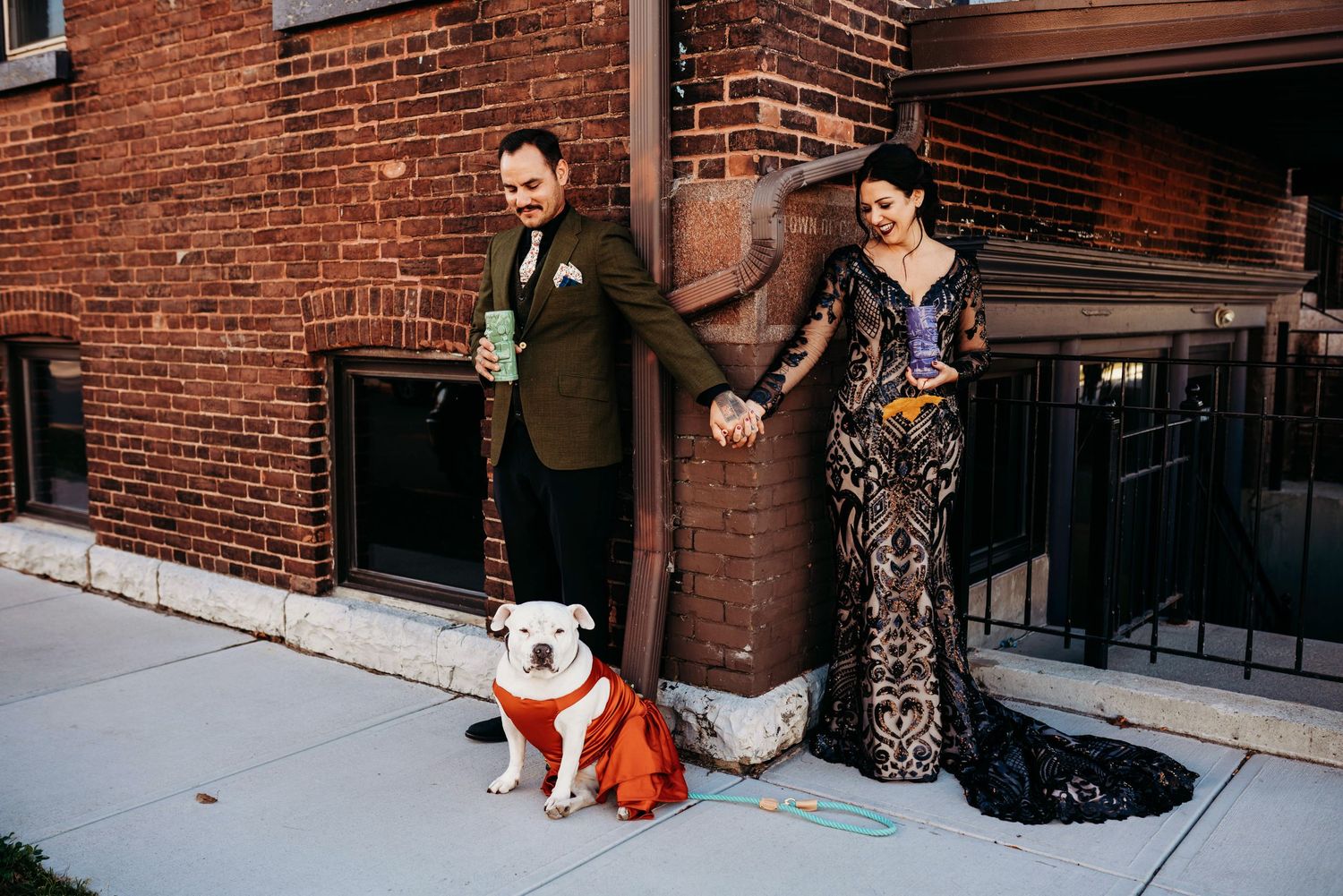 Bride and groom, with their dog, doing a first touch before the wedding ceremony.
