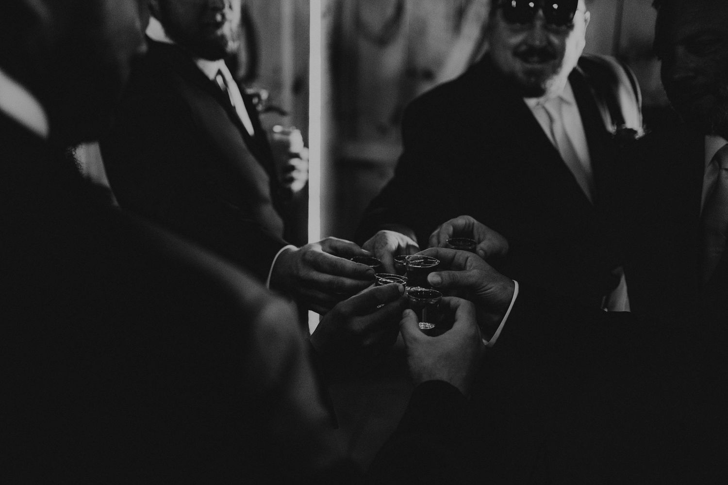 Groom and Groomsmen doing a toast before they take a shot.