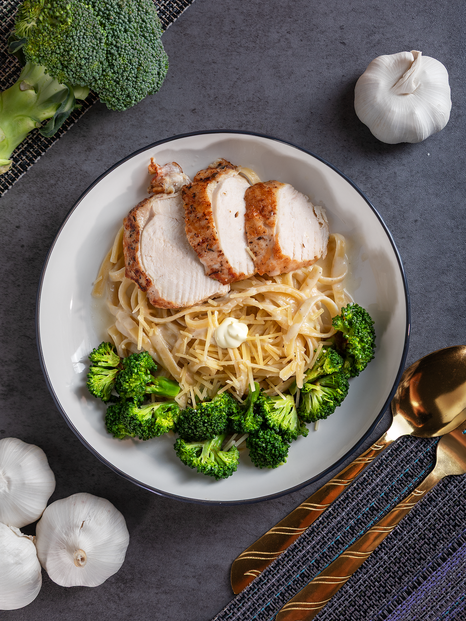 Restaurant food photography featuring a healthy chicken and vegetable dish styled for menu and social media promotion.