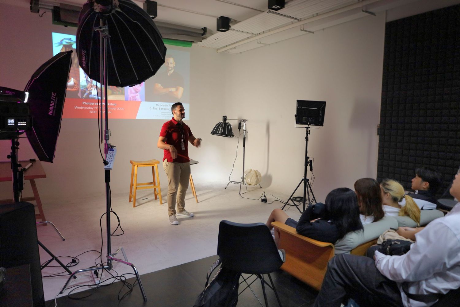 Behind-the-scenes studio photography showcasing a professional portrait session and lighting setup.