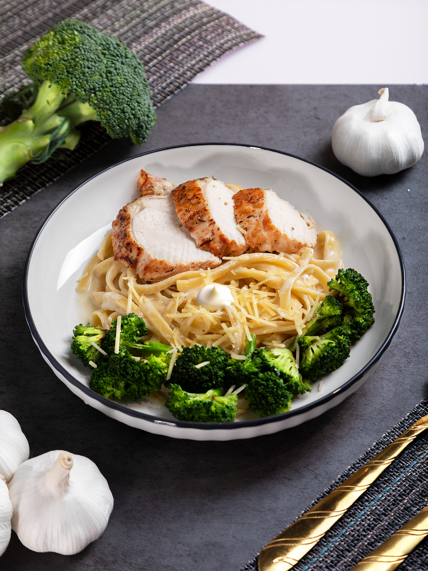 Commercial food photography featuring a plated chicken dish with vegetables captured for restaurant branding and menu use.