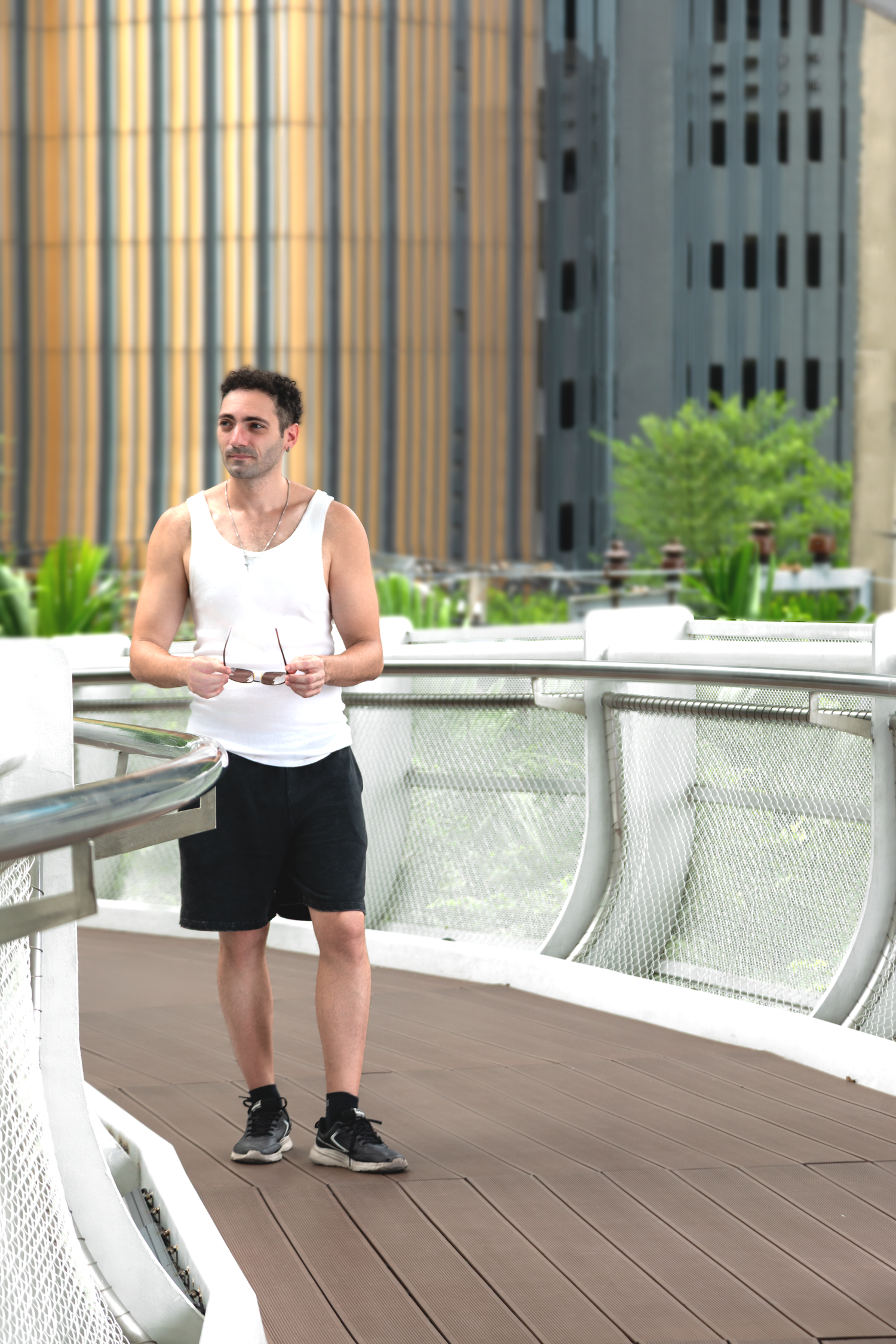 Corporate lifestyle photography featuring a professional male subject in an urban business environment.