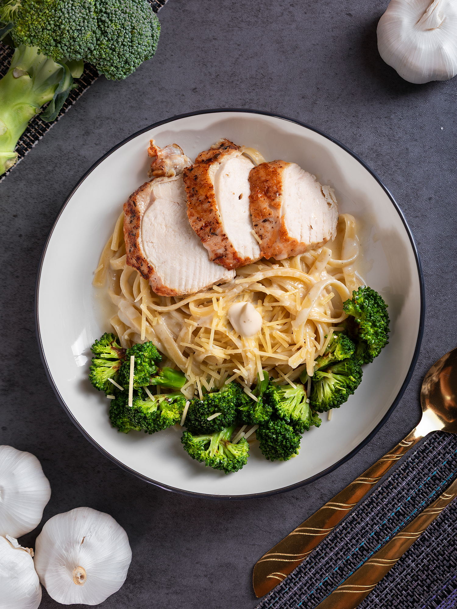 Professional restaurant food photography featuring a healthy chicken and vegetable meal styled for café and menu marketing.