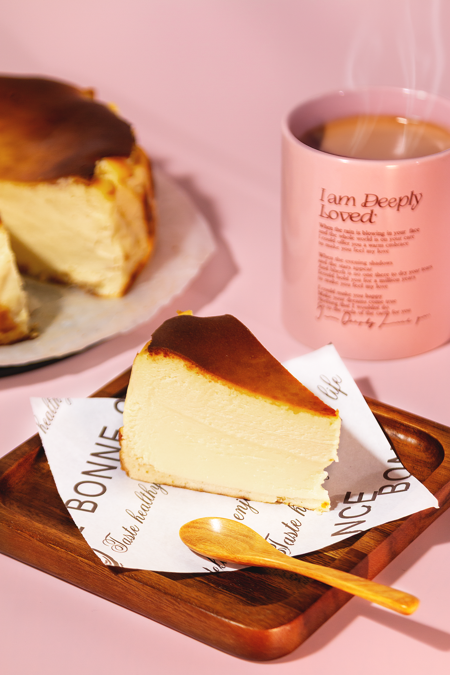 Professional dessert photography showcasing cheesecake and coffee in a bright commercial food styling setup.