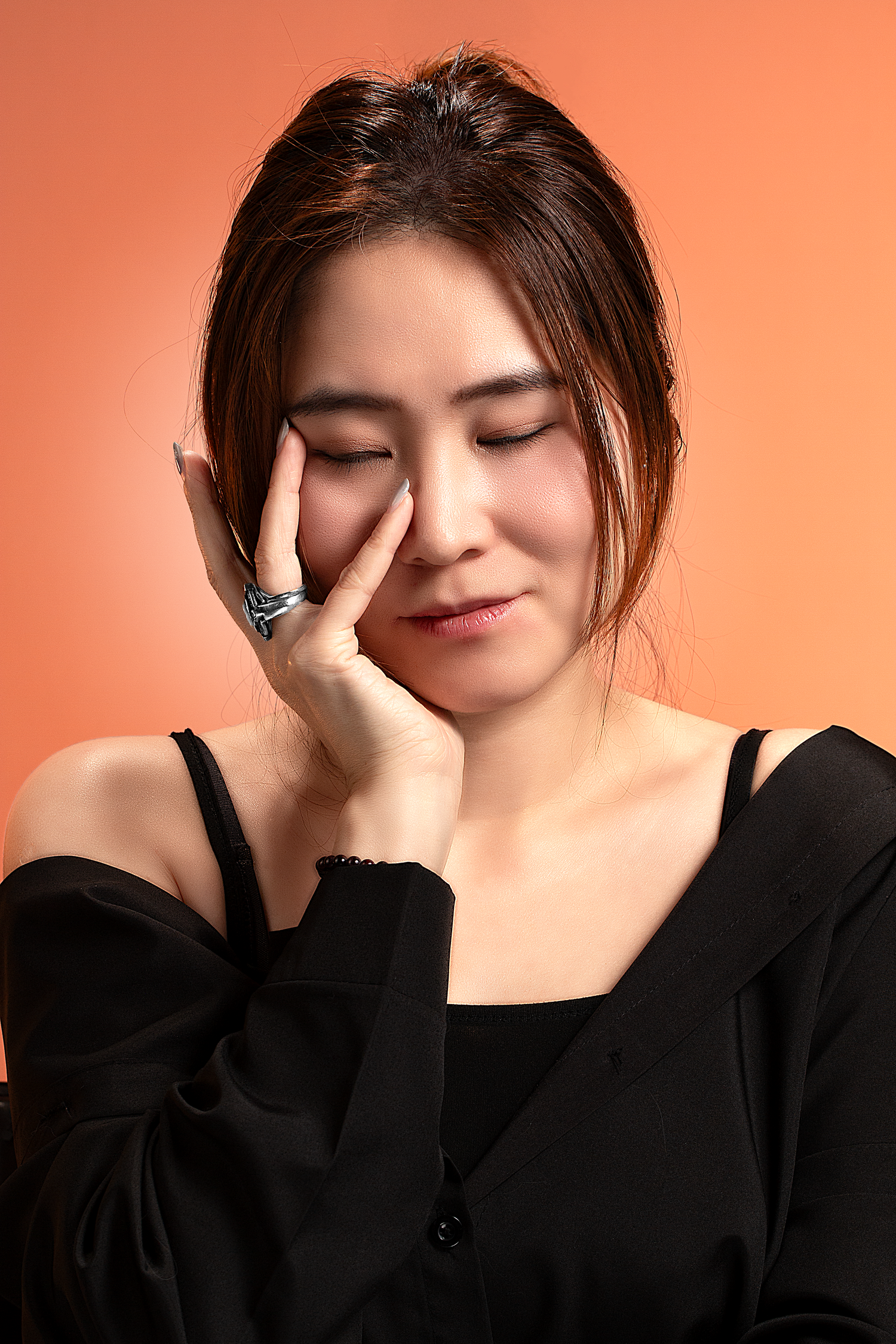 Professional studio portrait photography featuring a female model captured with clean lighting and natural expression.