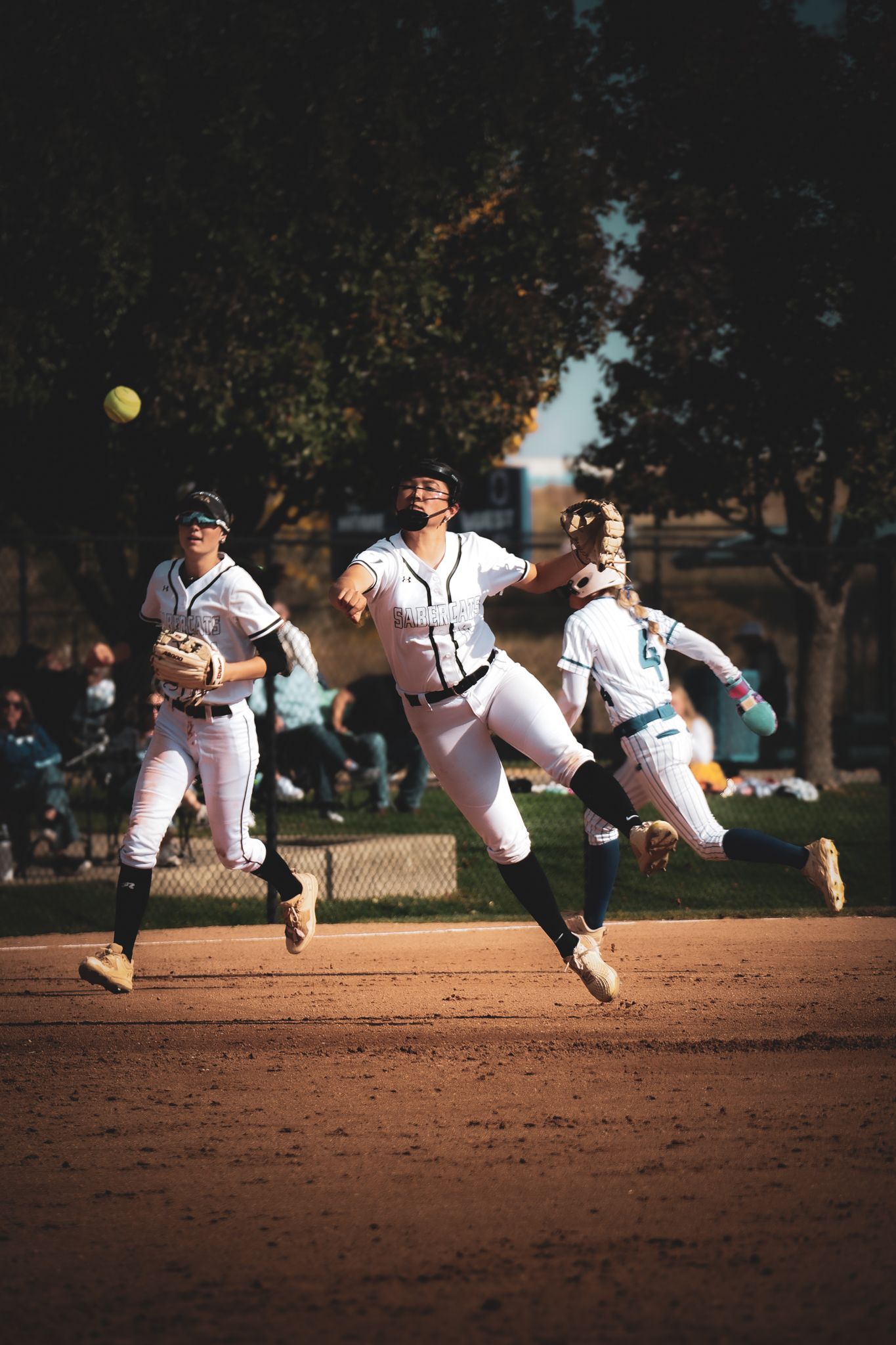 Baseball pitcher shown in sequence photos demonstrating pitching motion mechanics on dirt mound during game.