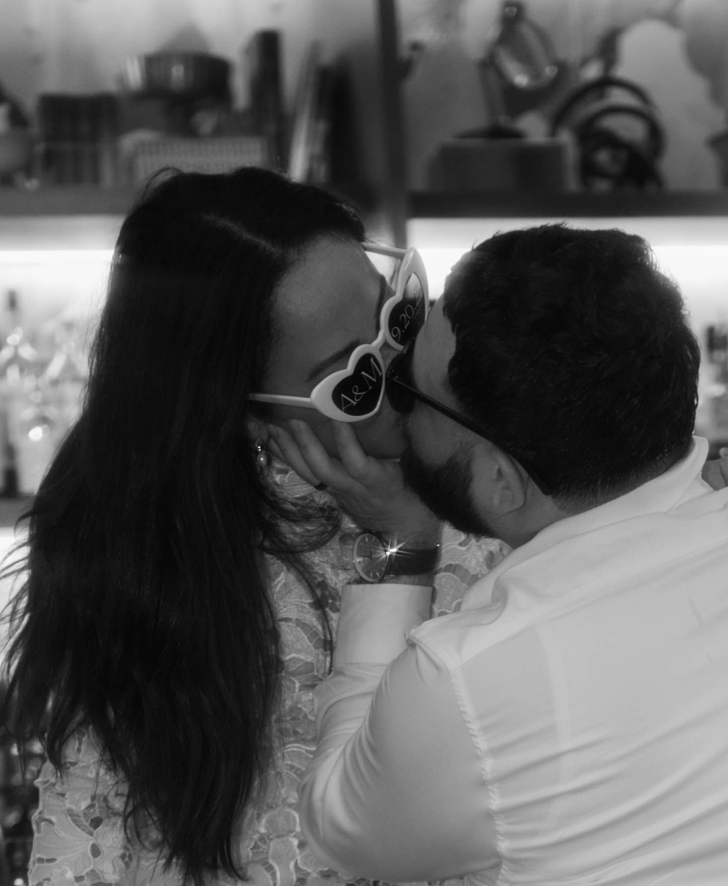 Black and white photo of a romantic dance moment at a celebration.