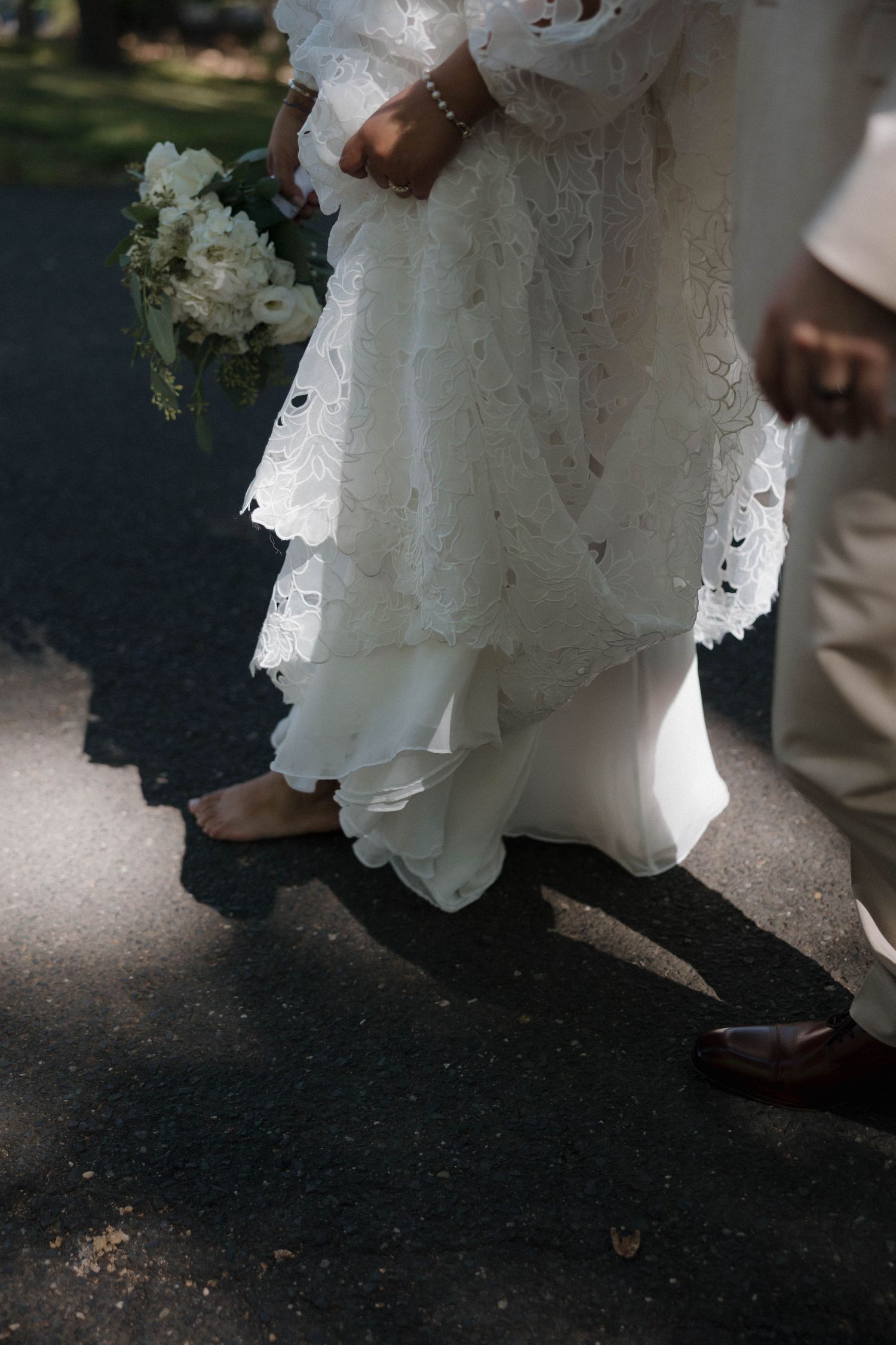 Close-up shots of a flowing white wedding dress hem during a dance sequence.