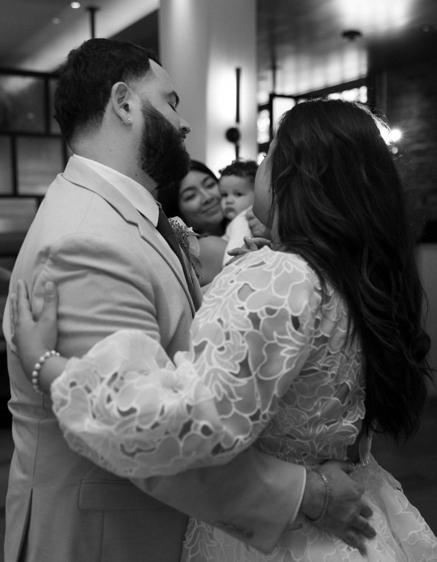 Romantic dance sequence showing close-up details of a bride's lace sleeve and intimate dance moments.