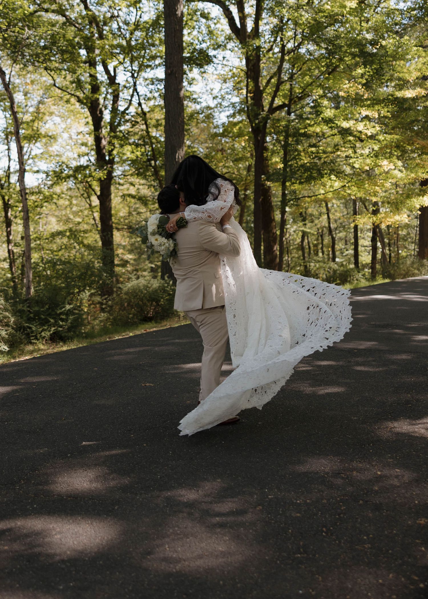 A series of dance lifts captured in a wooded outdoor setting with natural lighting.