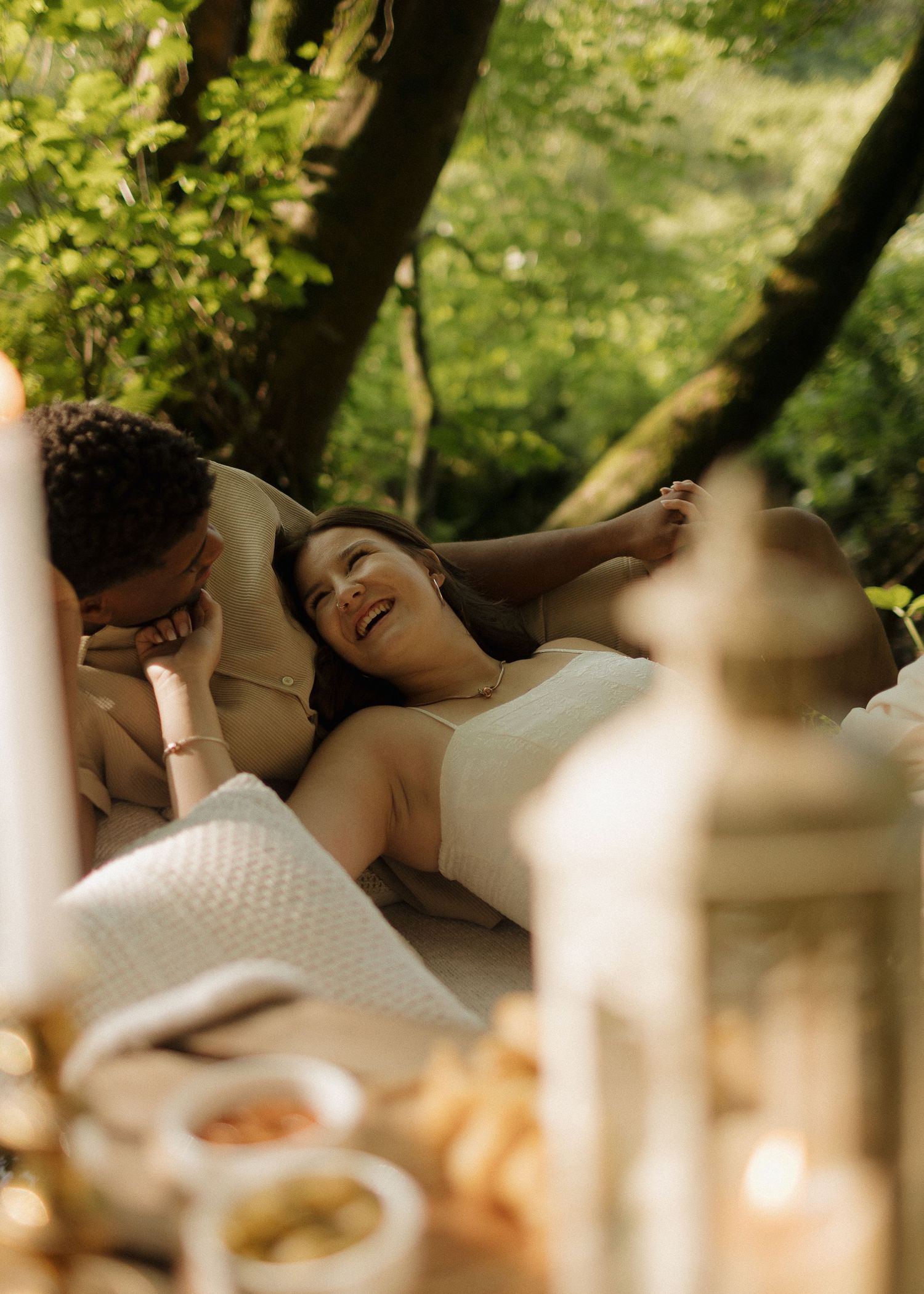 Romantic outdoor picnic scene with soft natural lighting and intimate atmosphere.