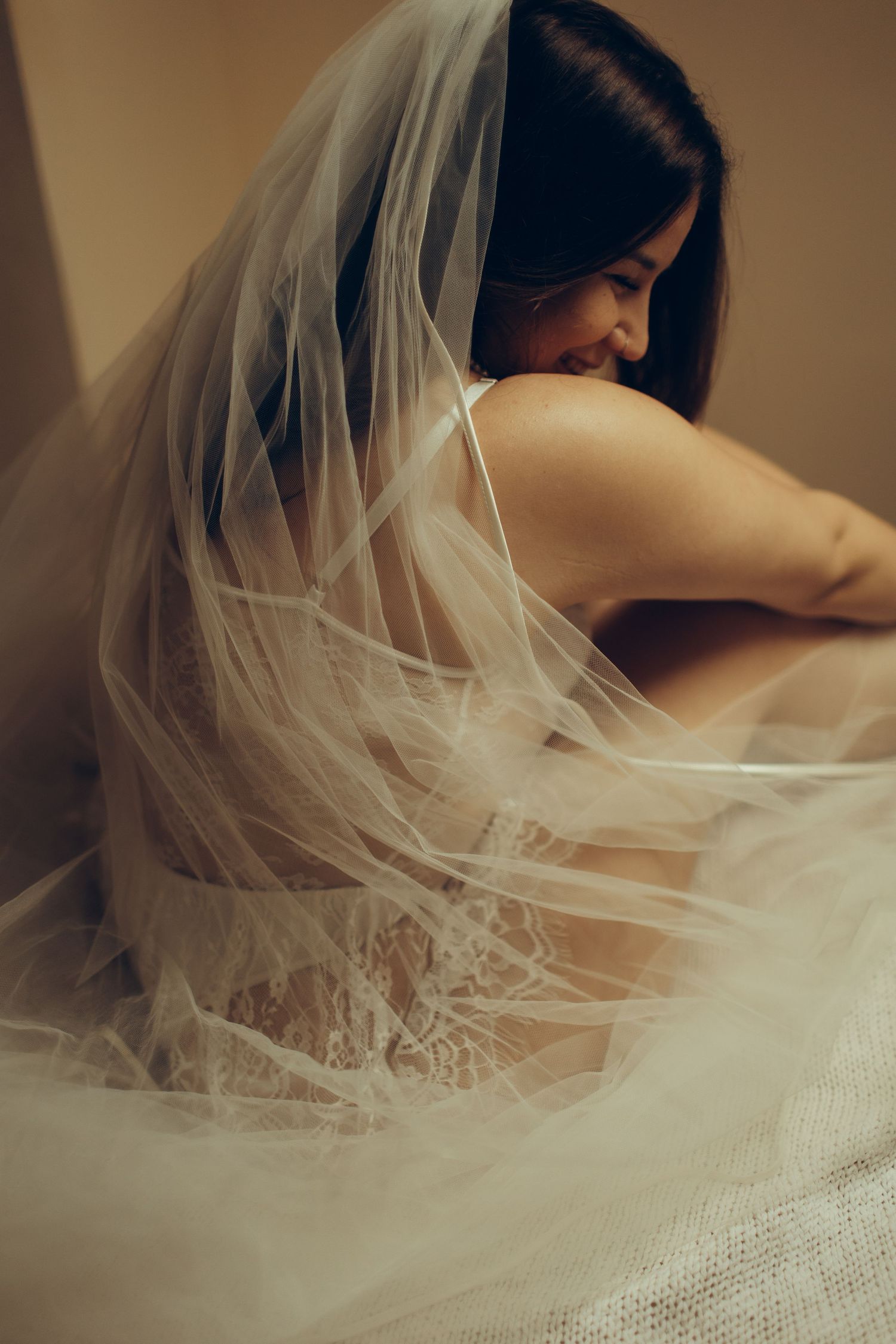 A series of ethereal bridal portraits showing flowing white veil and lace details in warm, romantic lighting.