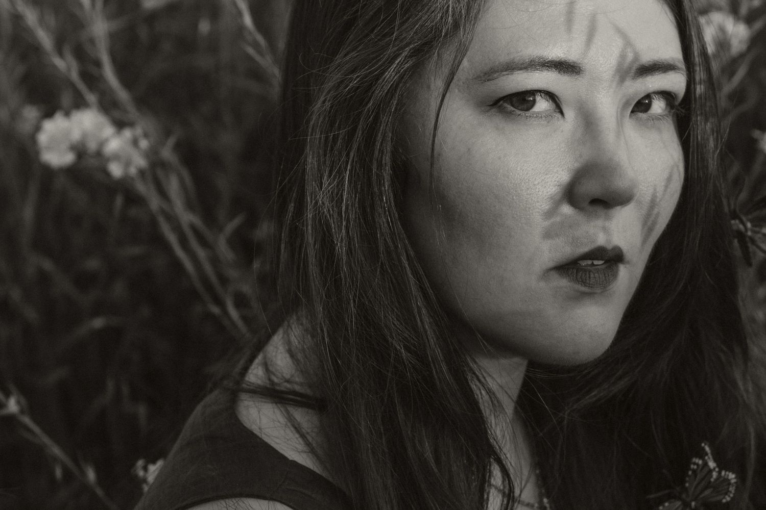 Dramatic black and white portrait series showing emotional expressions.