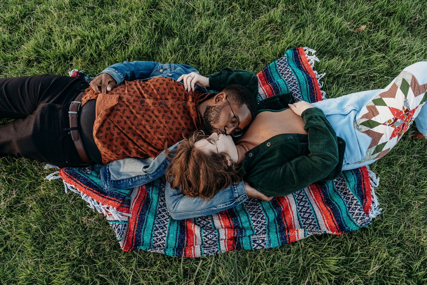 true color photo of a couple kissing on the floor