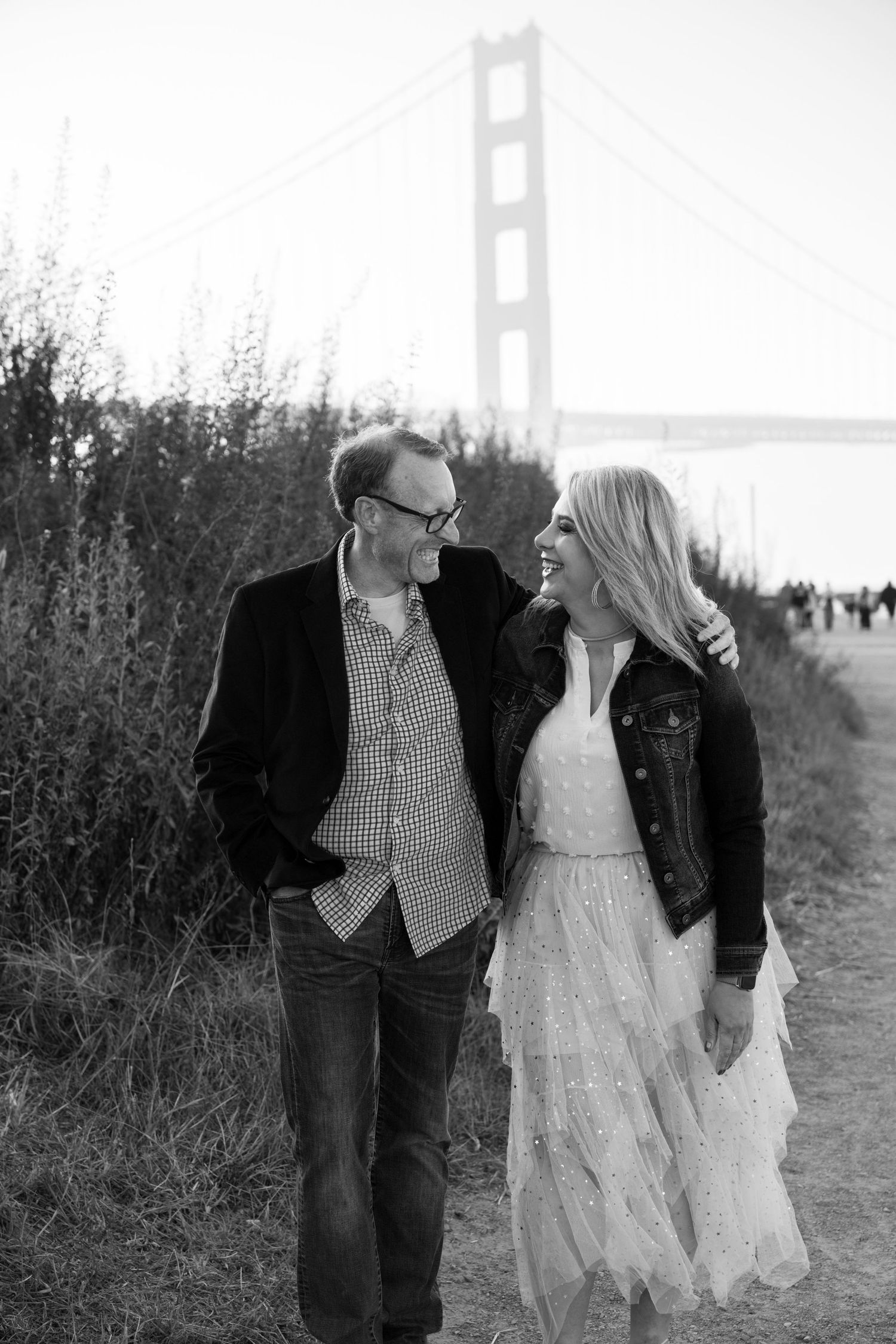 Monochrome image capturing the moment of an engagement proposal between two people