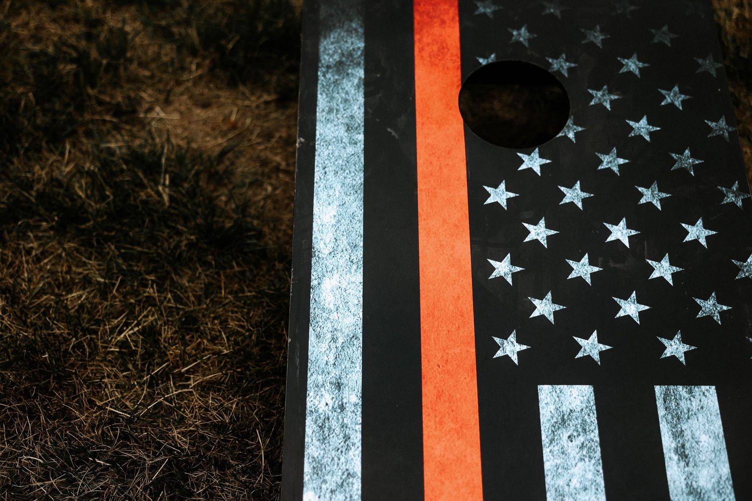 Thin red line American flag cornhole board with distressed finish honoring firefighters.