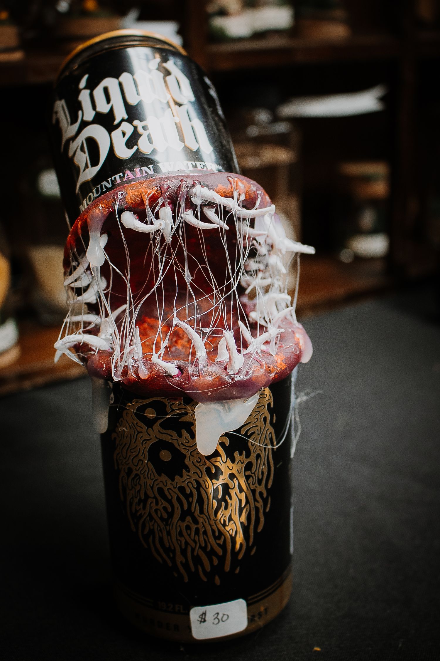 Liquid Death mountain water can with a decorative jellyfish art piece priced at $30.
