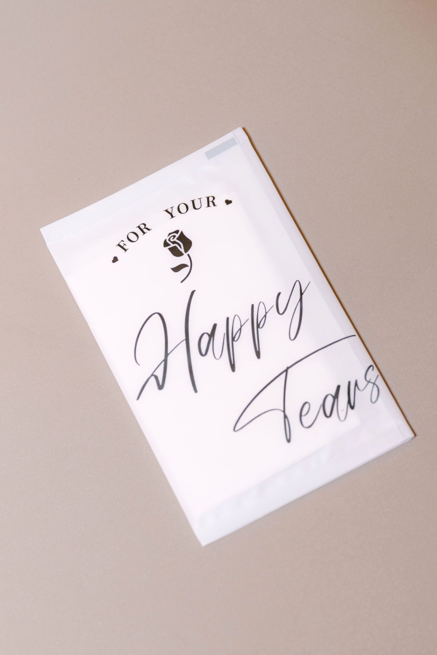 White wedding tissue packet printed with For Your Happy Tears in elegant calligraphy script.