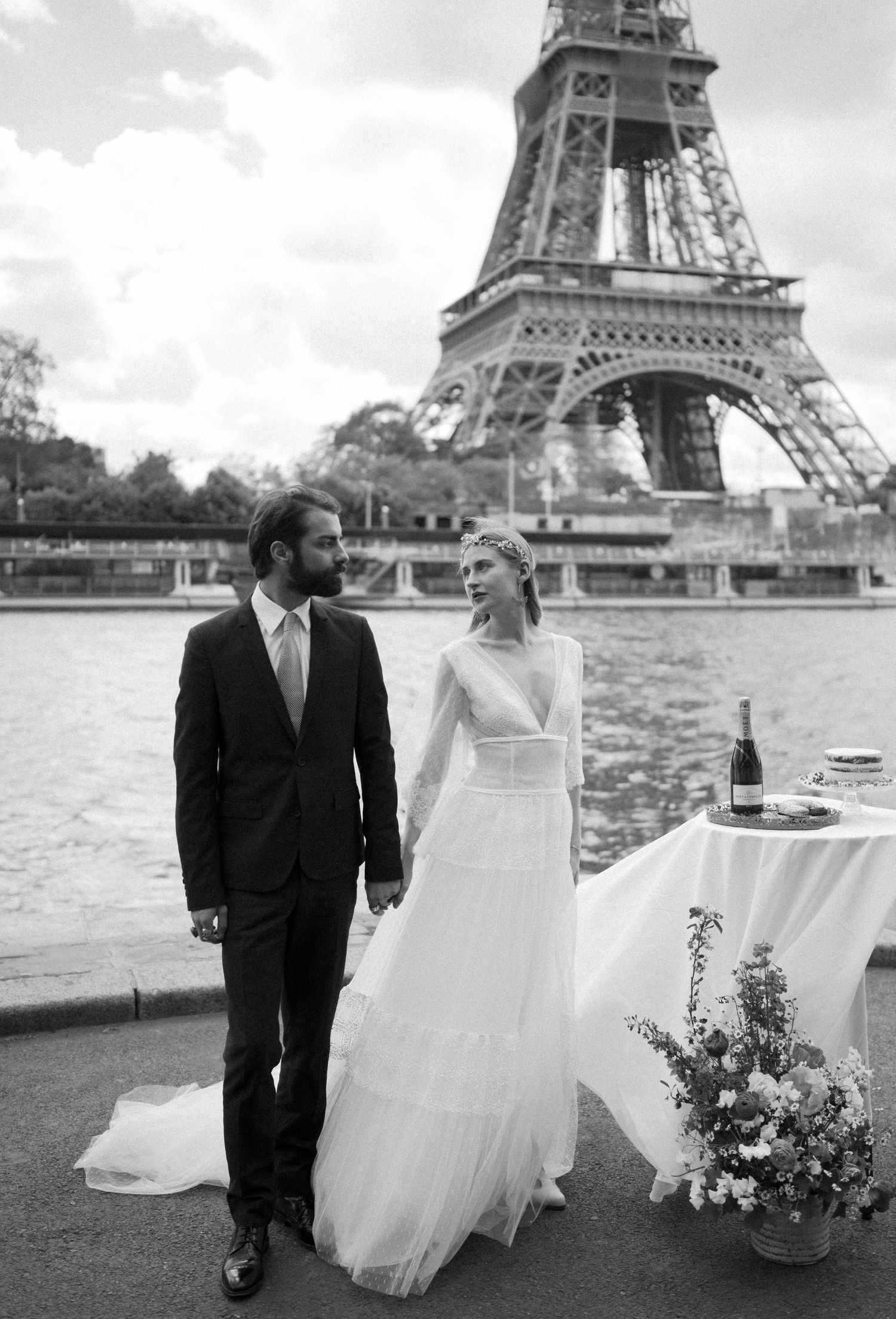 Black and white wedding photography with the Eiffel Tower creating a dramatic backdrop.