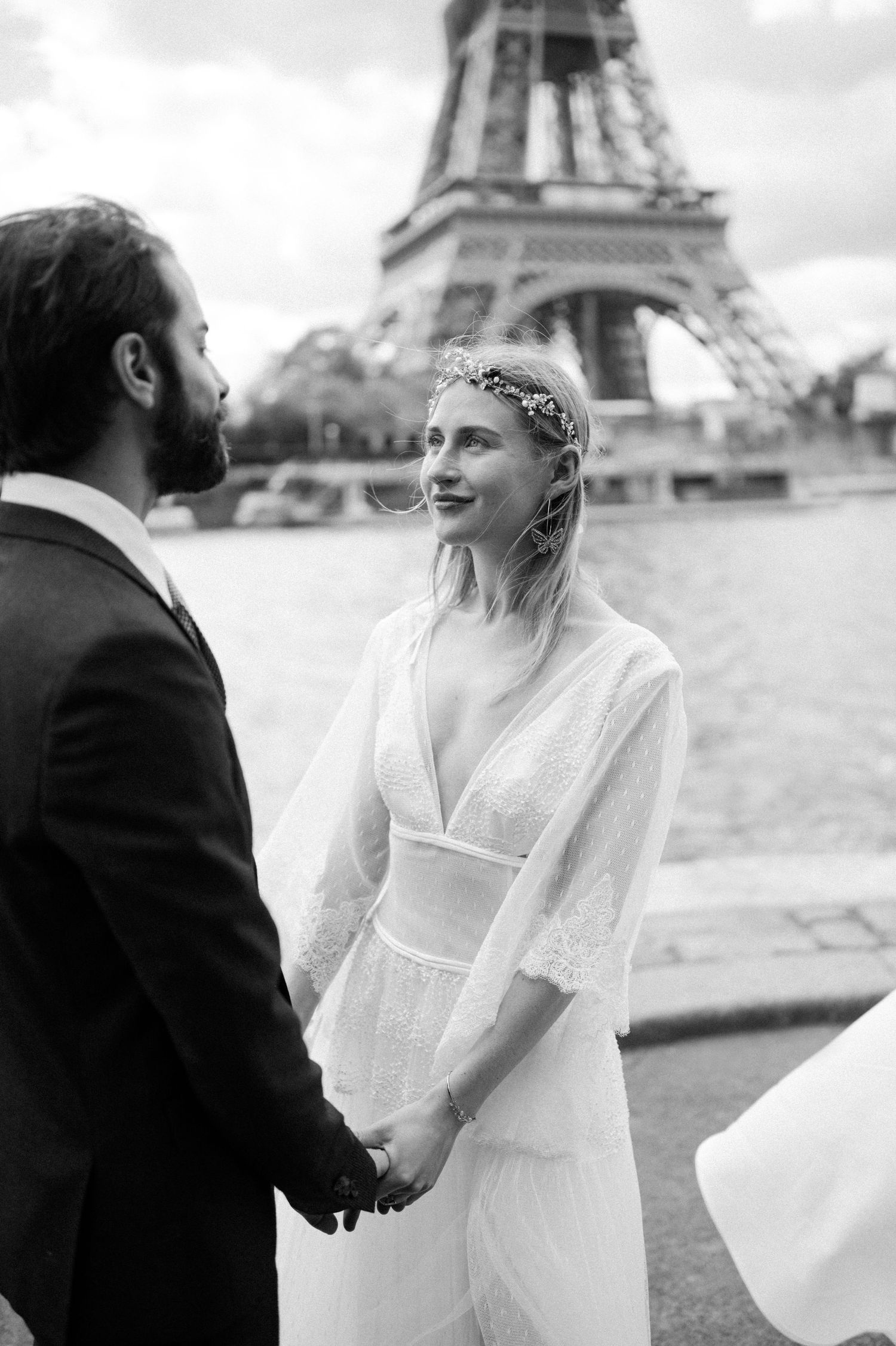 Classic black and white wedding portrait with Seine River and Eiffel Tower views.