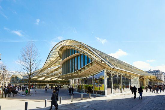 Modern curved glass and steel canopy structure of Forum des Halles in Paris.