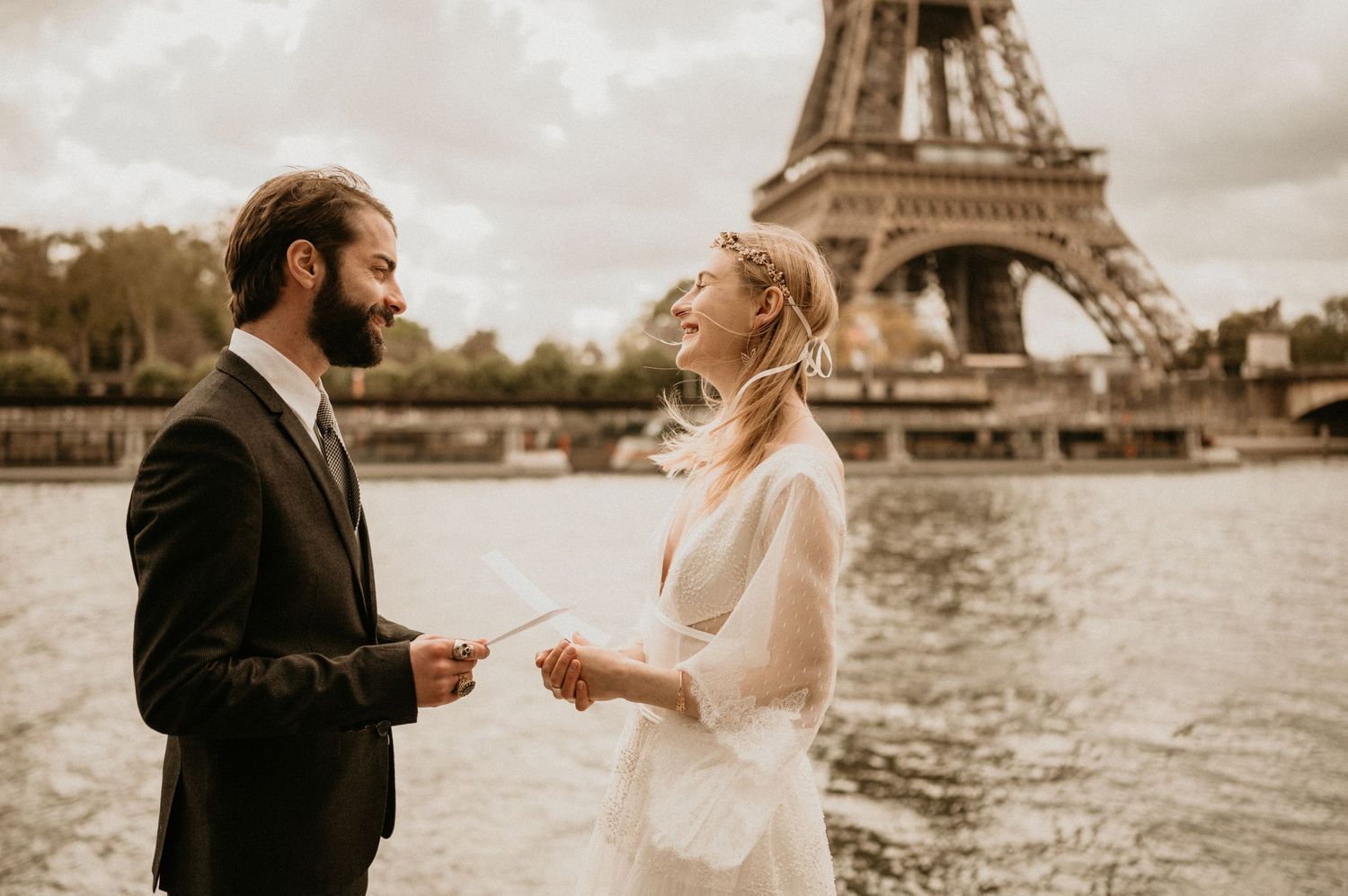 A romantic wedding moment captured in front of the Eiffel Tower in Paris.