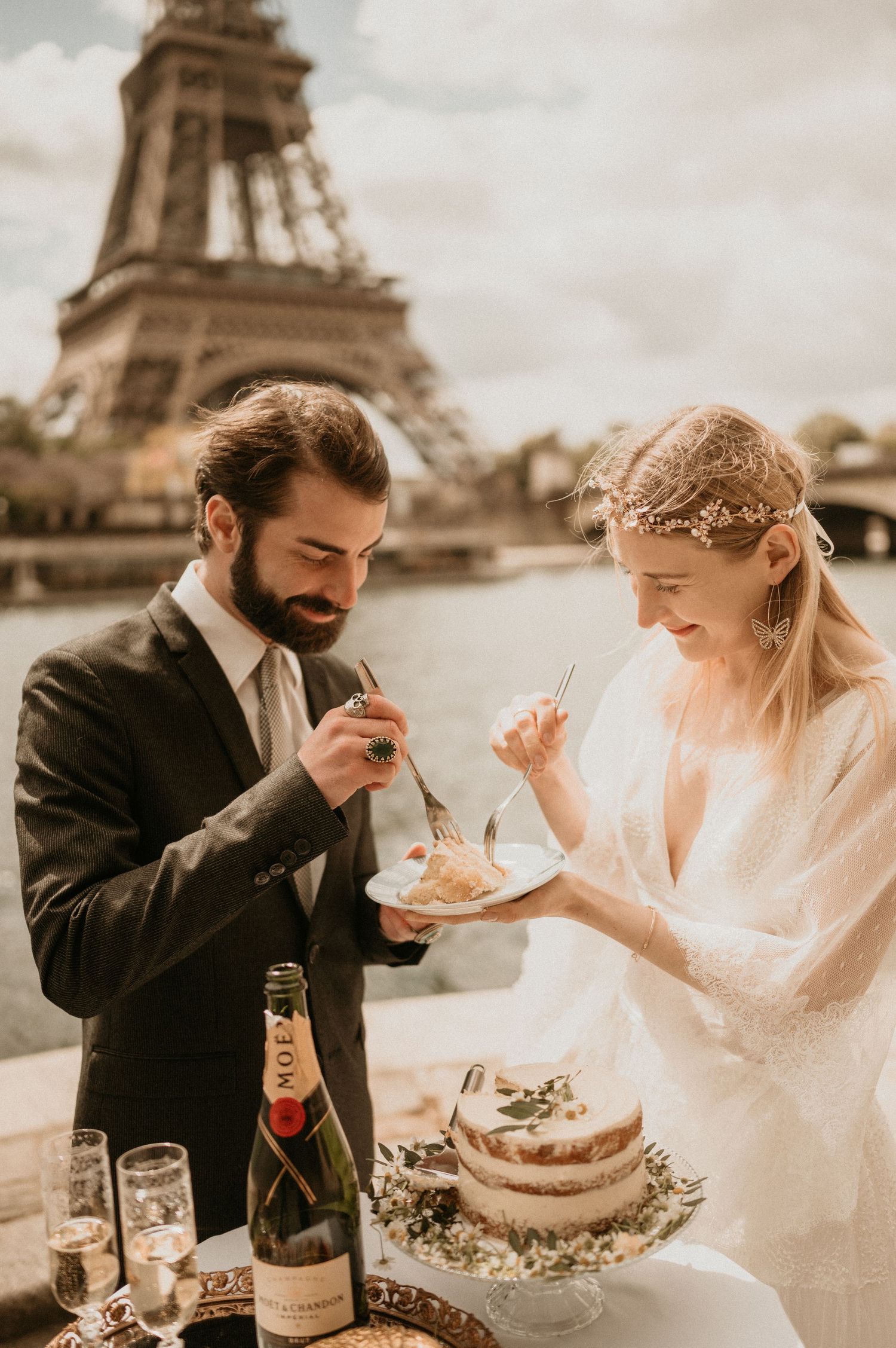 A romantic wedding dessert moment with the iconic Eiffel Tower backdrop in Paris.