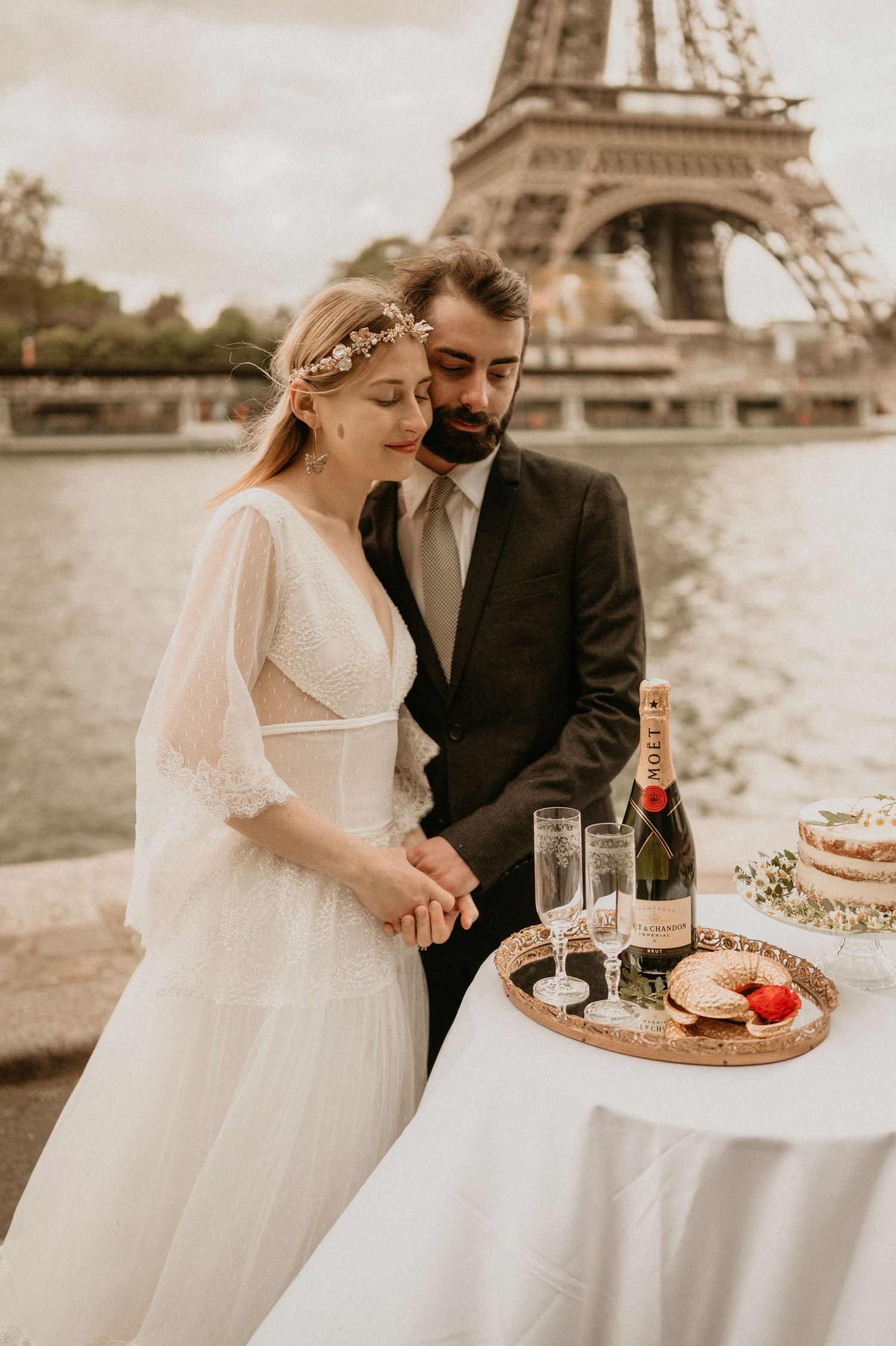 A romantic wedding celebration with champagne and desserts near the Eiffel Tower in Paris.