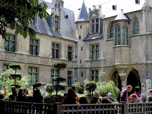 Medieval courtyard garden at Hotel de Cluny museum in Paris.