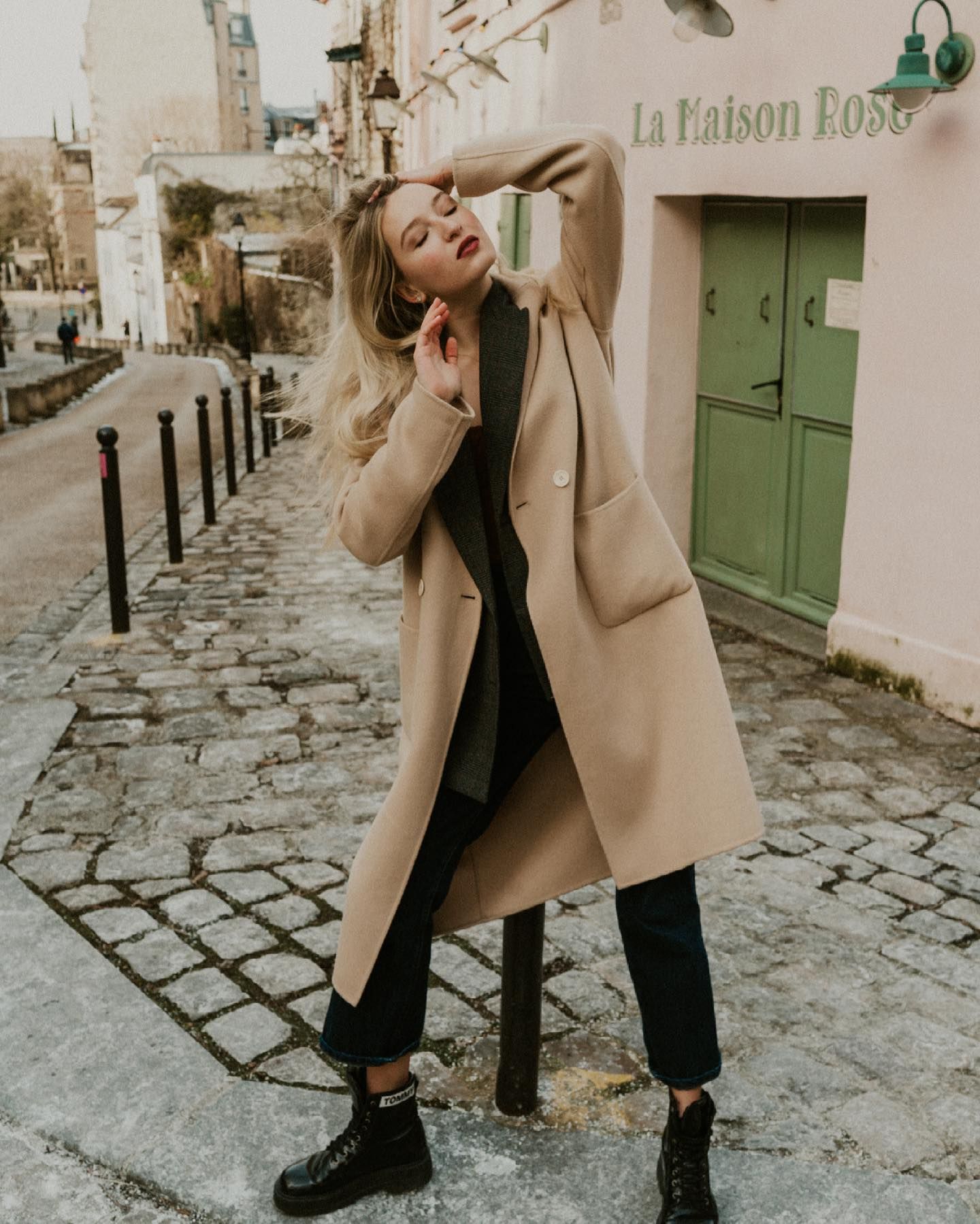 A carefree moment on a cobblestone street in Paris outside La Maison Rose.