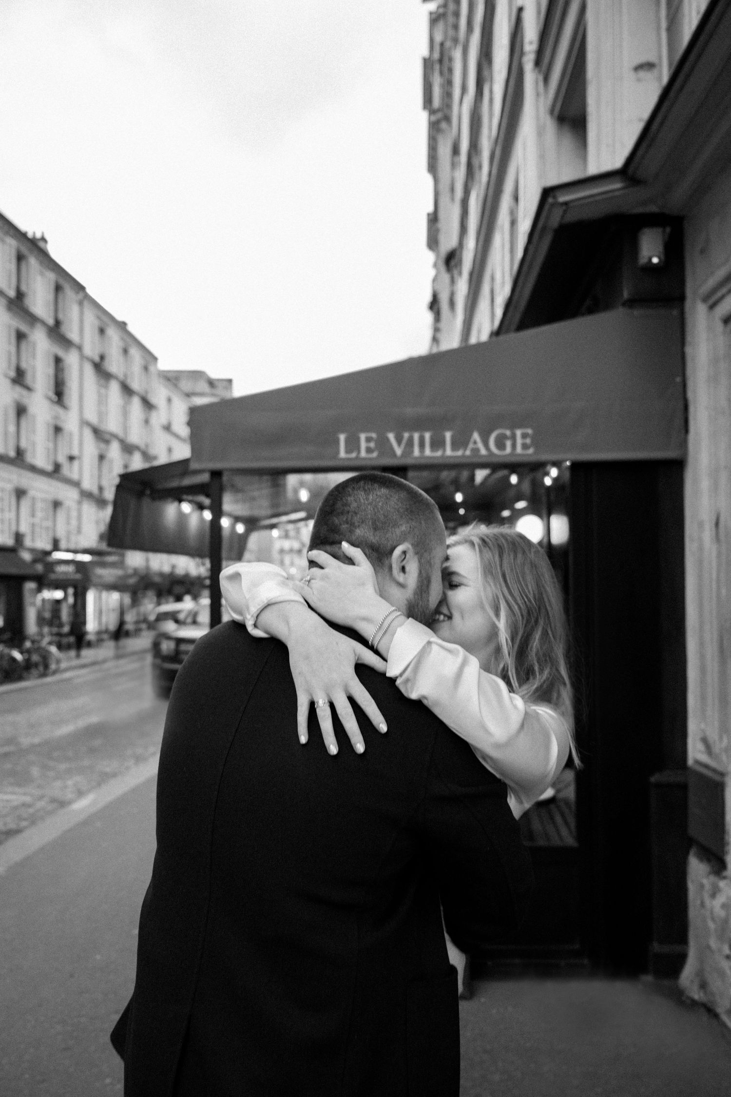 Intimate moment outside Le Consulat cafe in Montmartre, Paris.