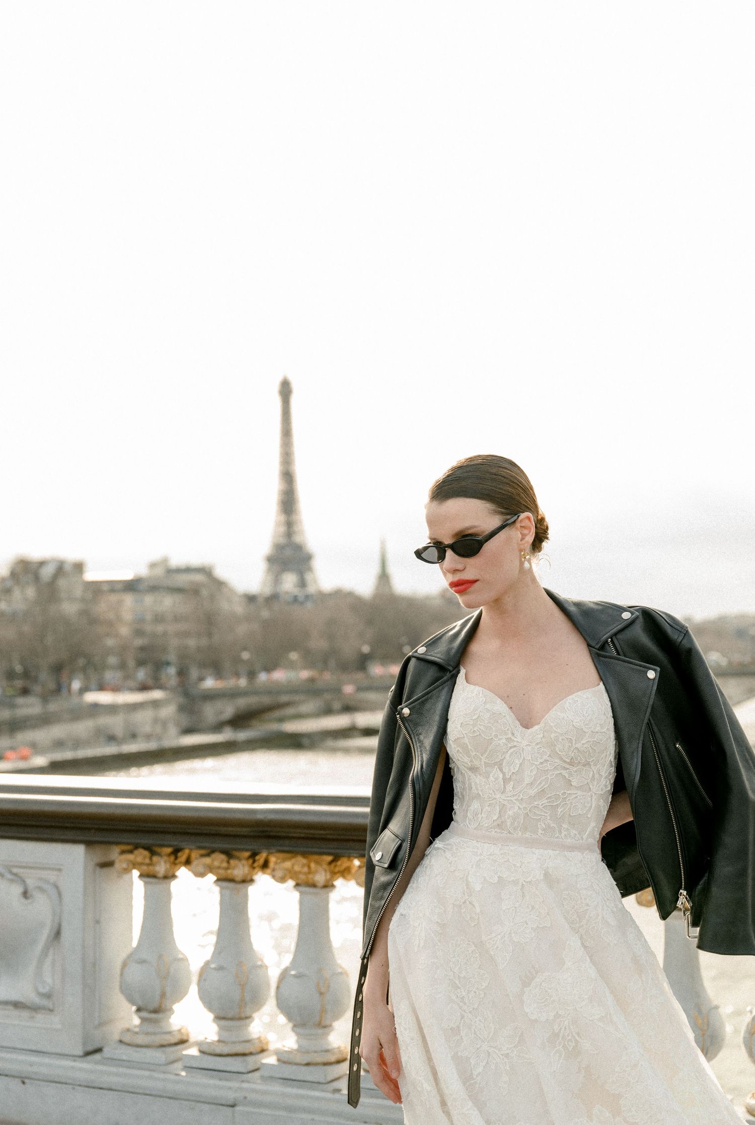 A stylish scene on a Parisian balcony with the Eiffel Tower visible in the background.