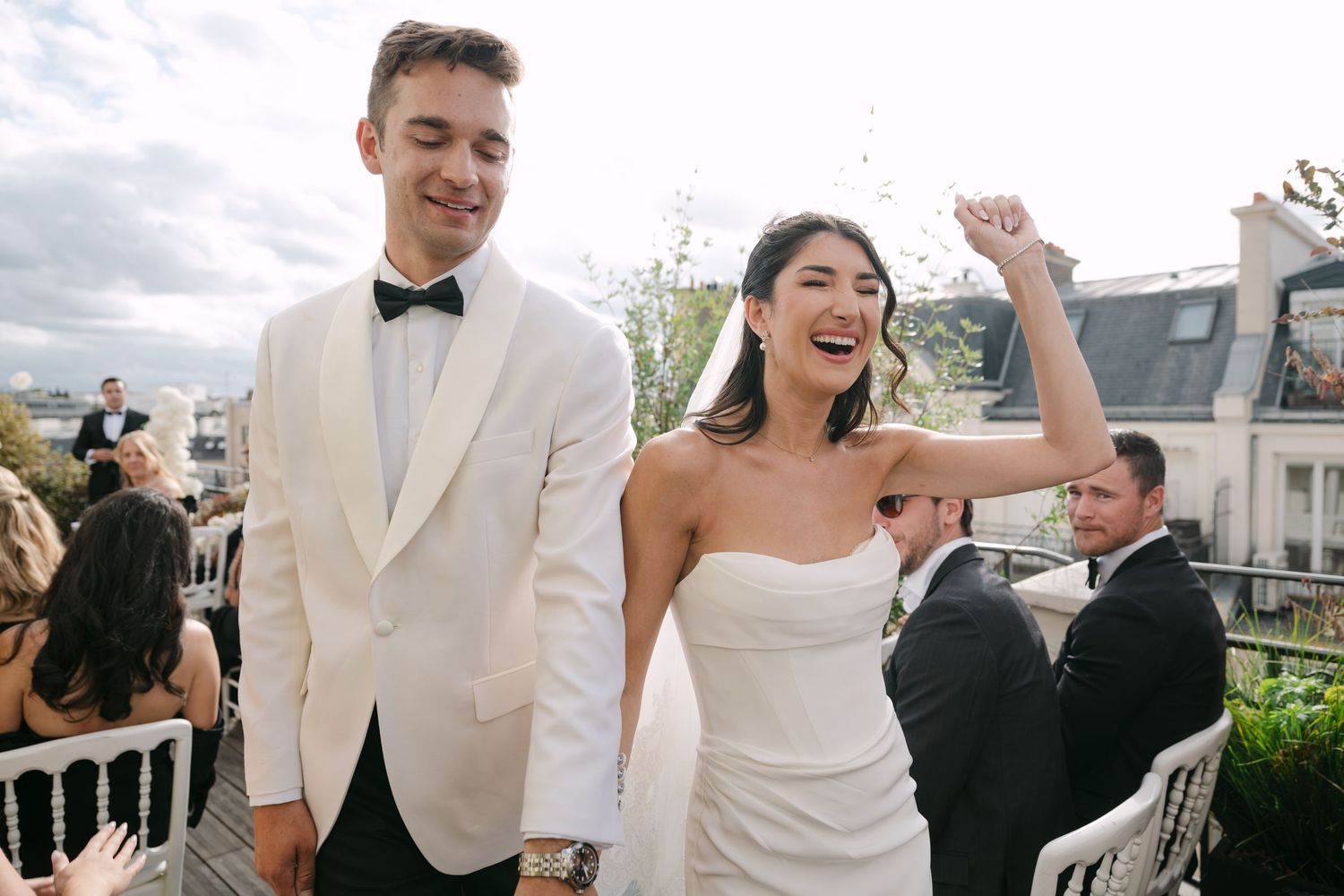 Wedding celebration captured in a series of candid moments with elegant white attire and natural lighting.