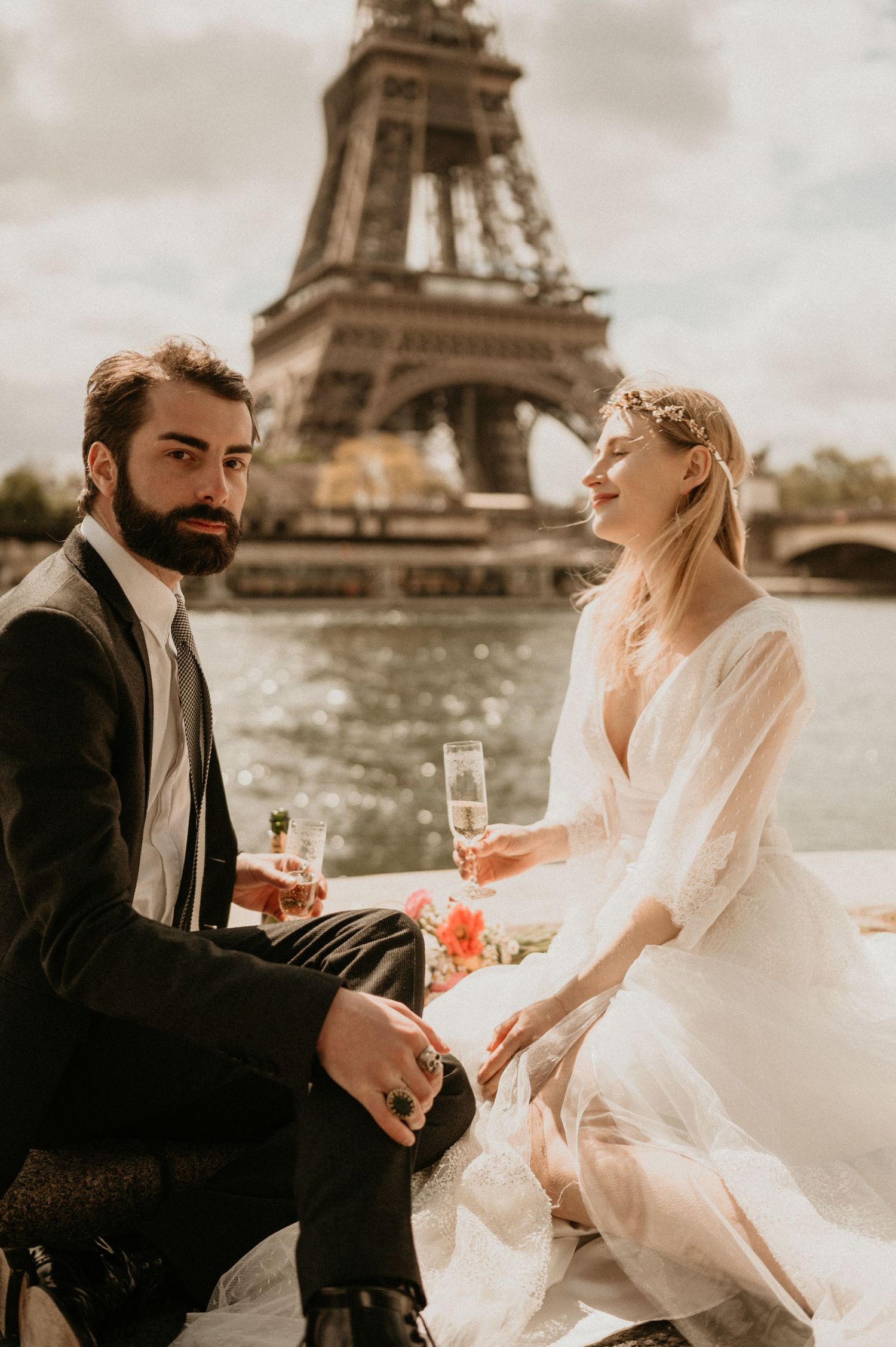 A couple shares an intimate moment during their Paris wedding photoshoot near the Eiffel Tower.